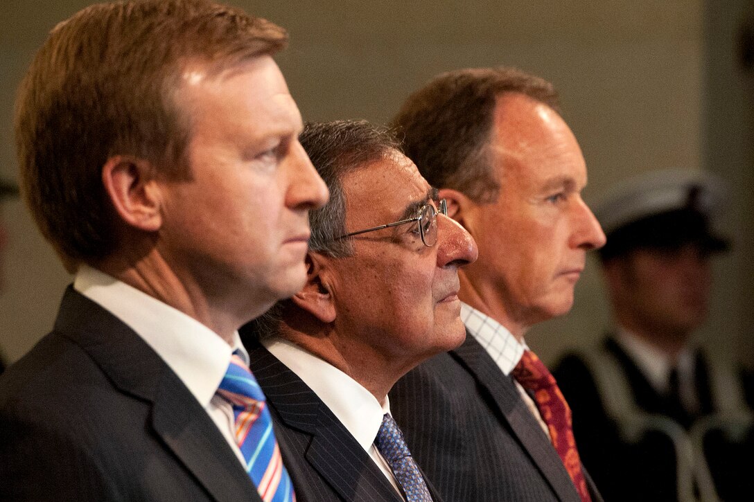 U.S. Defense Secretary Leon E. Panetta, center, stands with New Zealand Defense Minister Jonathan Coleman, left, and Roy Clare, Auckland War Memorial Museum director, in the museum's World War II Hall of Memories in Auckland, New Zealand, Sept. 21, 2012.