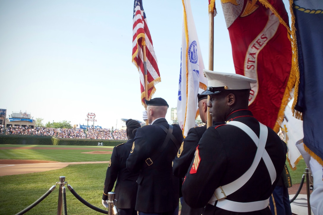 Sgt. Erik M. Dortch, a legal services specialist with 2nd Battalion, 24th Marine Regiment, 4th Marine Division, and a native of Lake Geneva, Wis., waits to present the Marine Corps colors during the opening ceremonies at Wrigley Field. “Events like these represent 2/24 in a big way because we are the only duty station here in Chicago so everyone knows about us and knows the great things that we are doing,” said Dortch.