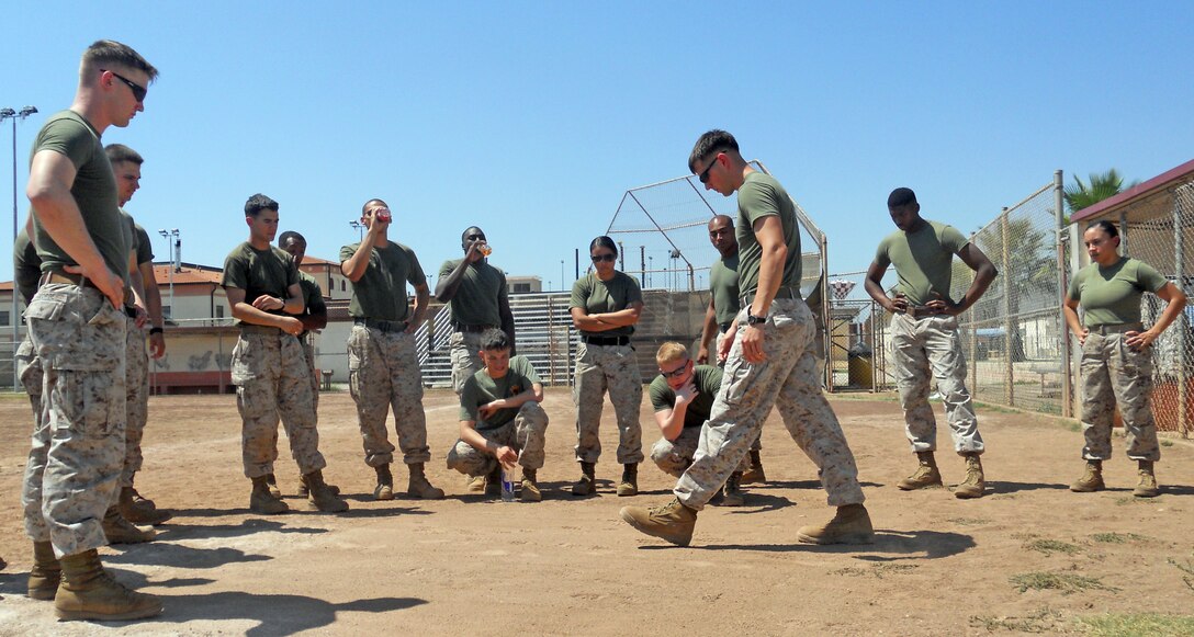 Sgt. Stefan Tunstall, Corporal's Course instructor and reservist with 3rd Force Reconnaissance Company in Mobile, Ala., demonstrates how to indentify enemy movement on security patrols using only foot prints, Aug. 23, 2012. Marines from Special-Purpose Marine Air-Ground Task Force Africa and the 24th Marine Expeditionary Unit's Joint Task Force Enabler participated in a three week Corporal's Course on Naval Air Station Sigonella, Sicily, Aug. 13 through Aug. 30, 2012. The course provides the Marines with necessary leadership skills and is designed to provide the war fighting skills, core values and mindset necessary for effective leadership of Marines