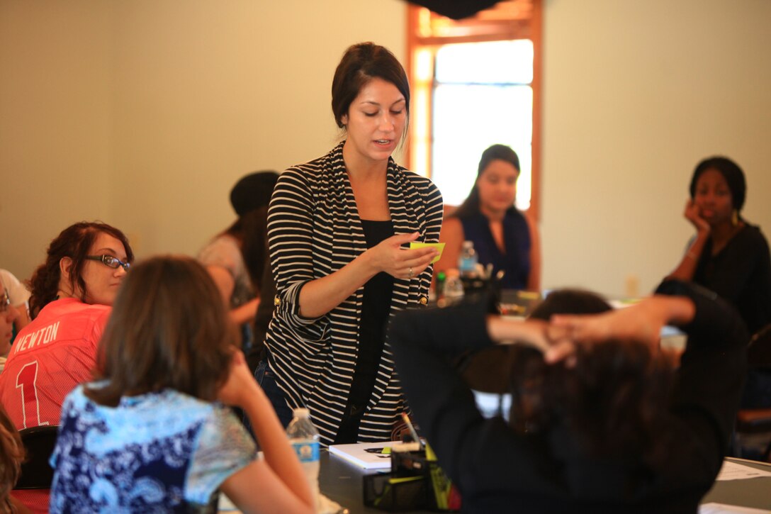 Jenna Angel, whose husband is a Marine with Combat Logistics Regiment 2, 2nd Marine Logistics Group, shares some of the information she learned about her fellow spouses during a Lifestyles, Insights, Networking, Knowledge and Skills class aboard Camp Lejeune, N.C., Sept. 17, 2012. The class helped the spouses learn about the Marine Corps’ traditions and build bonds between some of their peers. 