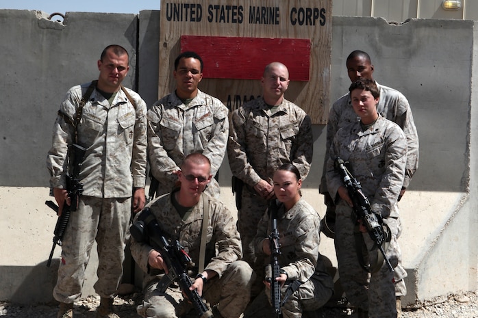 Landing support specialists with Combat Logistics Battalion 2, Combat Logistics Regiment 15, spent the night providing security and fighting off insurgents on Camp Bastion, Sept. 14. For Sgt. Rasheem Thomas, back right, his first night working on Camp Bastion is something he and his Marines will not soon forget. (Back row from left to right: Sgt. John Thornton, Cpl. Timothy Bruce, Staff Sgt. Justin Pauley and Sgt. Rasheem Thomas. Front row from left to right: Pfc. Jacob Karnes, Lance Cpl. Danielle Ritter and Cpl. Jenna Owings.)