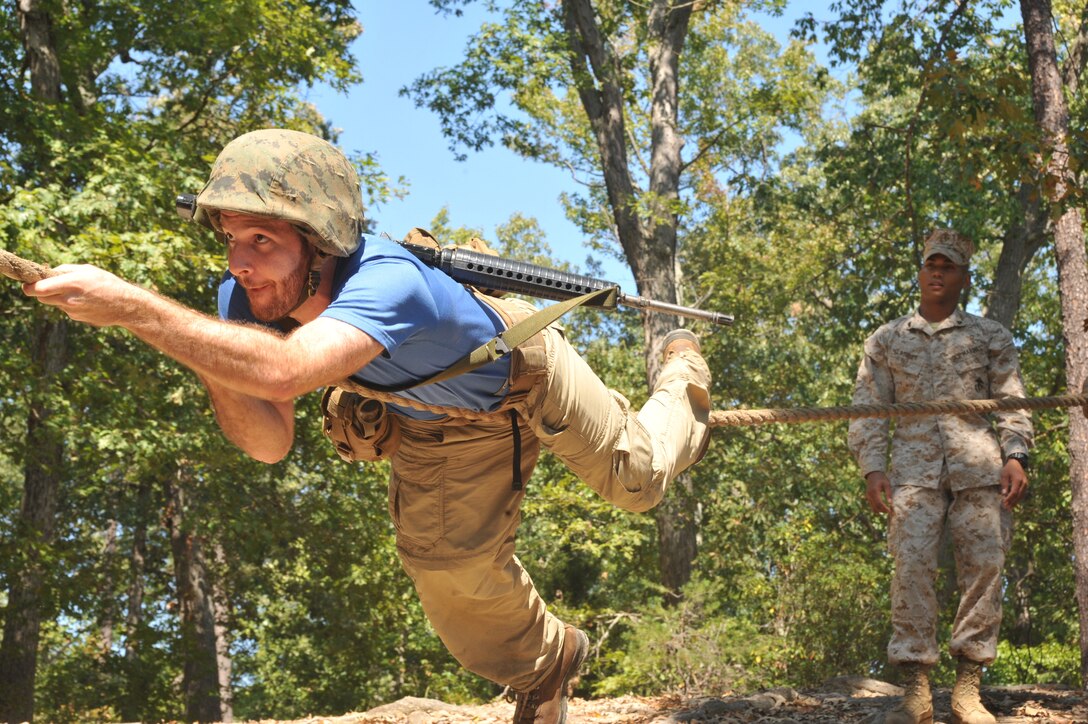 Jacob Cohn, Wharton School University of Pennsylvania graduate student, complete an obstacle from the Officer Candidates School?s combat course during the Quantico Leadership Venture at OCS on Sept. 21. The venture was a two-day event.
