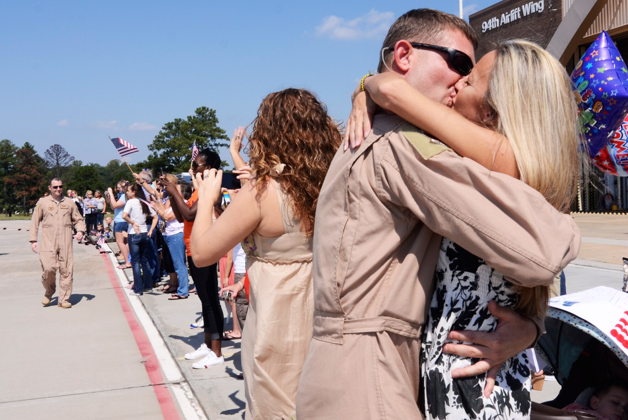 Members of the 94th Airlift Wing are welcomed home during a homecoming ceremony at Dobbins Air Reserve Base Sept. 22. Over 100 Reservists are scheduled to return to Dobbins ARB from the Middle East Sept. 21-24. (U.S. Air Force photo/Don Peek)