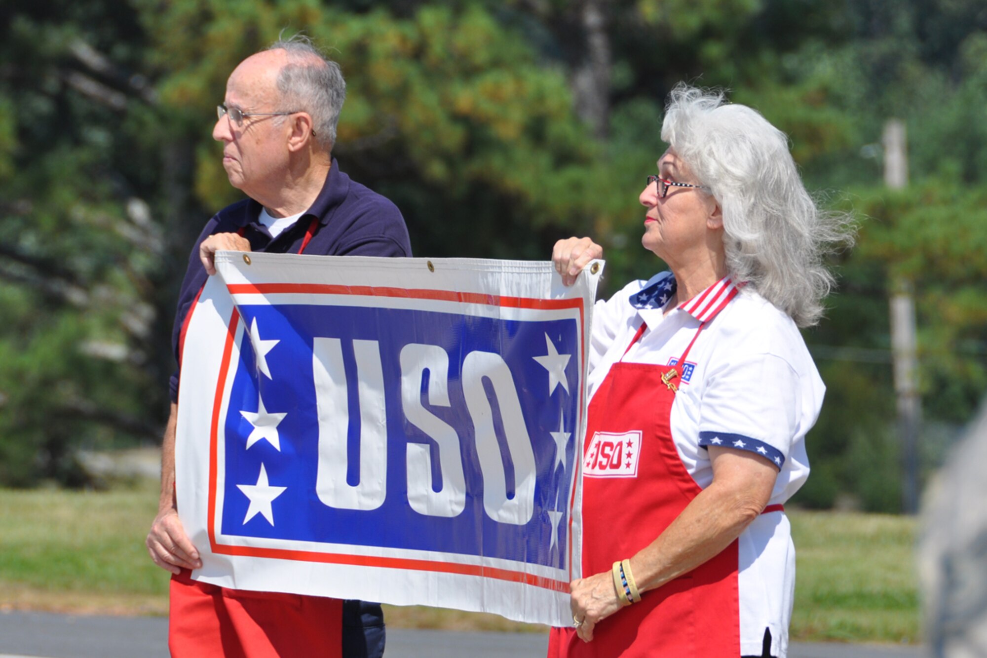 Jack and Patricia Solomon of the United Services Organization (USO) welcome returning members of the 94th Airlift Wing during a homecoming ceremony at Dobbins Air Reserve Base Sept. 22. Over 100 Reservists are scheduled to return to Dobbins ARB from the Middle East Sept. 21-24. (U.S. Air Force photo/James Branch)