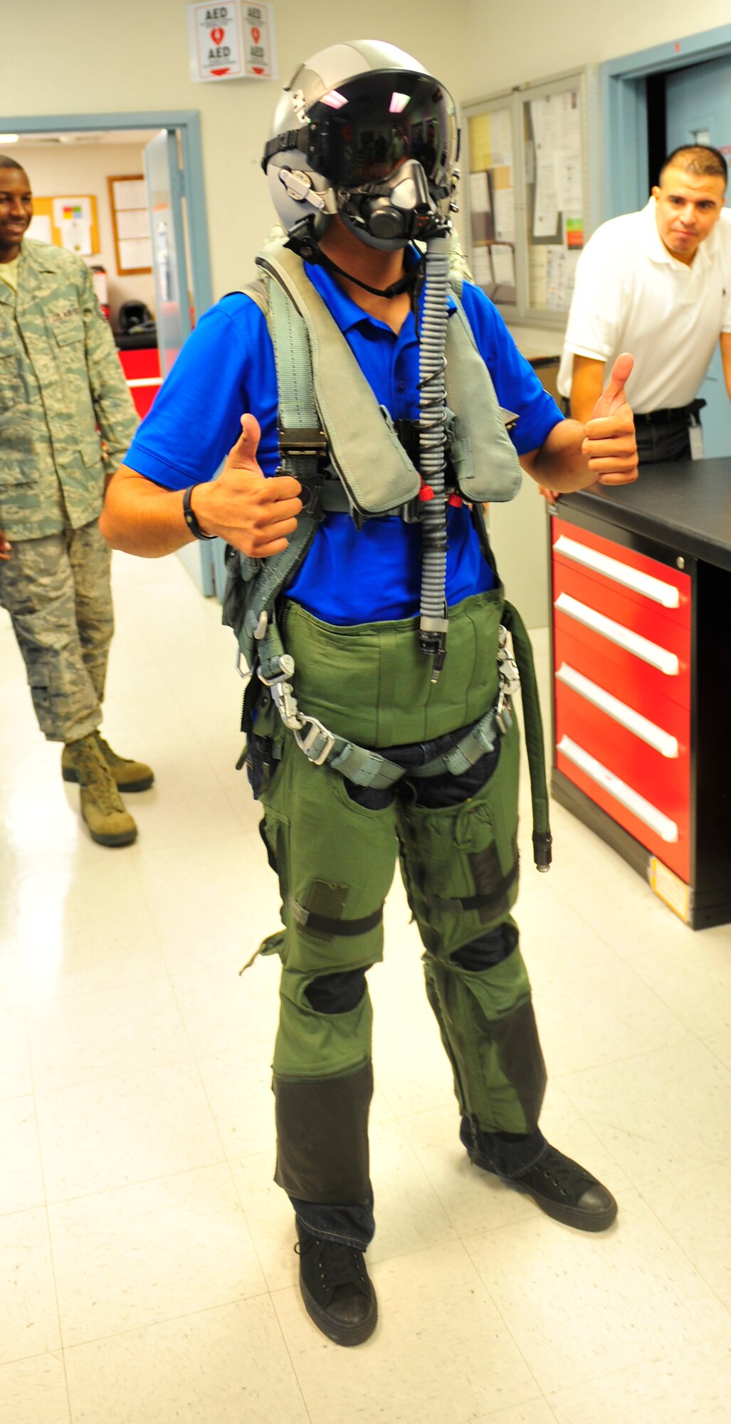 NAVAL AIR STATION FORT WORTH JOINT RESERVE BASE, TEXAS -- Hector Arana Jr. gives two thumbs up at 457th Aircrew Flight Equipment Shop here Sept. 20 during a base tour. Arana, National Hot Rod Association Pro-Stock Motorcycle Racing Rookie of the Year in 2011, and his team are in the Dallas area for the AAA Texas NHRA Fall Nationals drag race at Texas Motorplex in Ennis, Texas. (U.S. Air Force photo/Senior Airman Martha Whipple)