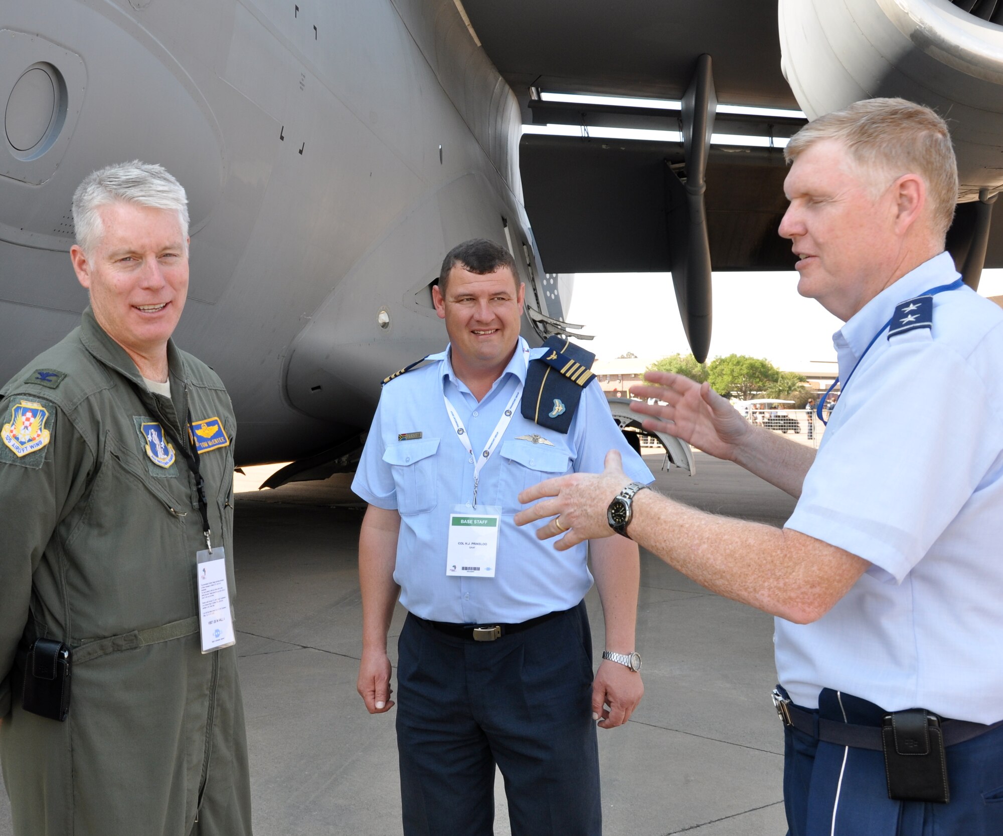 Maj. Gen. Verle Johnston, the New York Air National Guard commander (left) and Col. Thomas McEntee, C-17 pilot and 105th Airlift Wing Operations Group commander discuss the C-17 Globemaster III’s capabilities with Col. Jurgens Prinsloo, commanding officer of the South African Air Force’s 28th Squadron (center), Sept. 20.   The unit is part of a U.S. military contingent displaying aircraft and equipment during the Africa Aerospace and Defense Airshow and Exhibition at the South Africa National Defense Force’s Waterkloof Air Force Base. (U.S. Army photo/Master Sgt. Corine Lombardo)