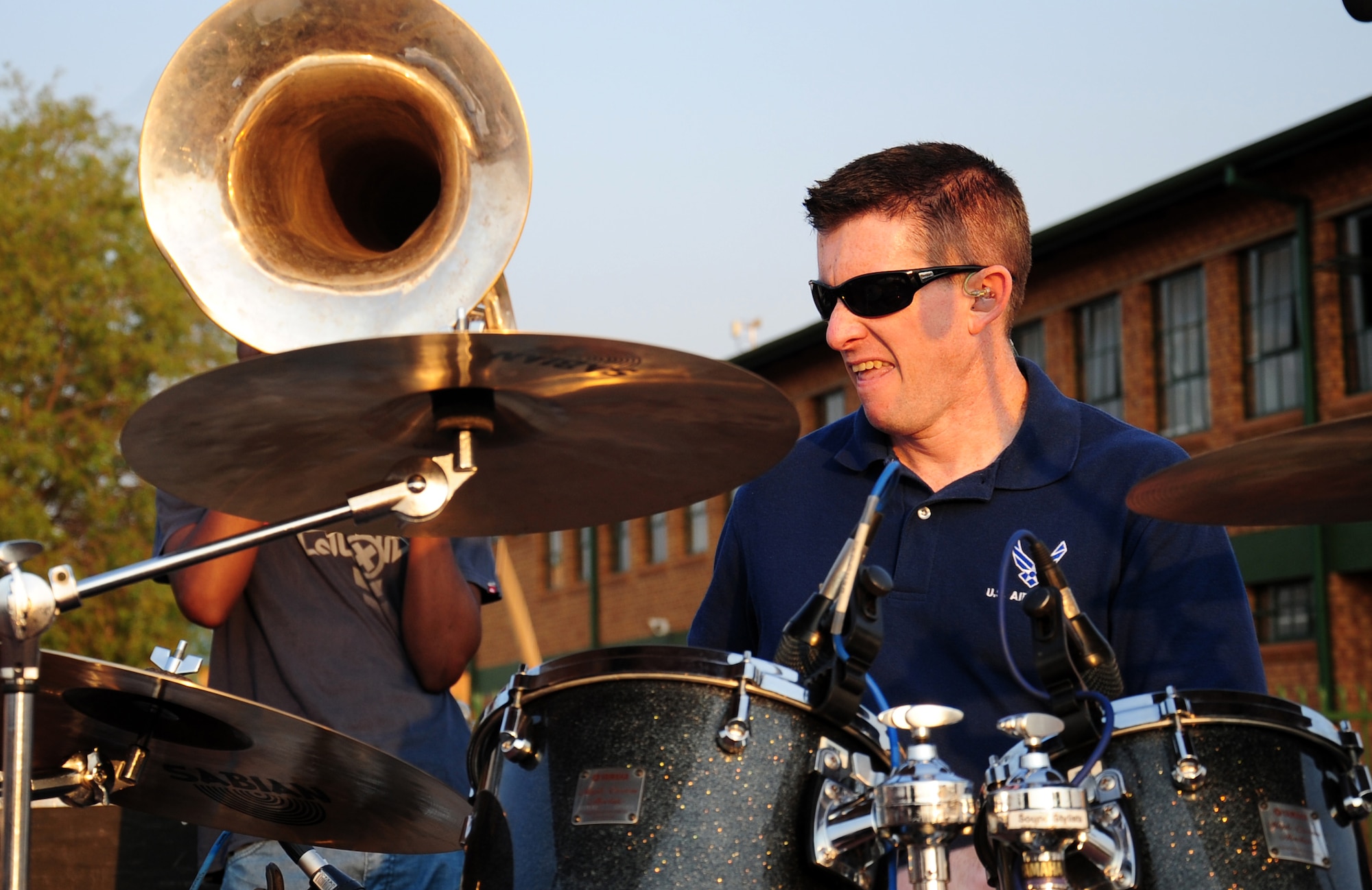 CULLINAN, South Africa -- Staff Sgt. Robert Browning, U. S. Air Forces in Europe Band percussionist, plays the drums with members of the De Beers PPC Cullinan Field Band drumline during a performance here, Sept. 18. The band, Touch 'n Go, has made three performances in local communities across South Africa and will be performing at the Africa Aerospace and Defense Exposition Sept. 22-23 at 10 a.m. and 2 p.m. on both days. This year's exposition which is free and open to the public is expected to draw 50,000 visitors each day. (U.S. Air Force photo by Staff Sgt. Debbie Lockhart)