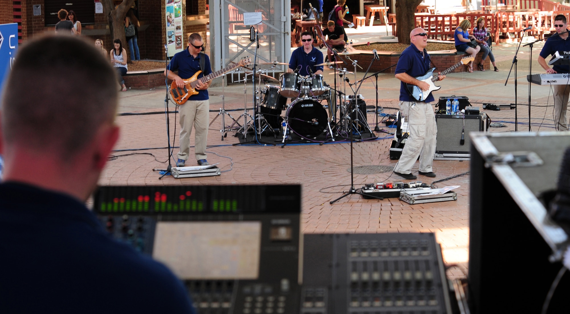 VANDERBIJLPARK, South Africa -- Tech Sgt. Nick Wellman, U.S. Air Forces in Europe Band, Touch 'n Go audio technichian, monitors the sound board while other members of the band perform for students and instructors of the Northern University here, Sept. 19. The band, Touch 'n Go, has made three performances in local communities across South Africa and has been invited to perform at the Africa Aerospace and Defense Exposition Sept. 22-23 at 10 a.m. and 2 p.m. on both days. This year’s exposition is one of the world’s premier aerospace and defense events, which is expected to draw in crowds of more than 50,000 visitors per day. (U.S. Air Force photo by Staff Sgt. Debbie Lockhart)