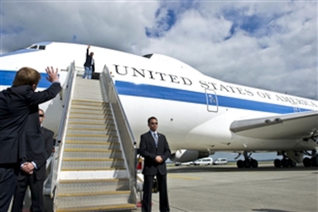 U.S. Defense Secretary Leon E. Panetta waves goodbye to New Zealand Defense Minister Jonathan Coleman in Auckland, New Zealand, Sept. 22, 2012. Panetta visited Tokyo and Beijing before concluding his weeklong trip to the Asia-Pacific region in Auckland.