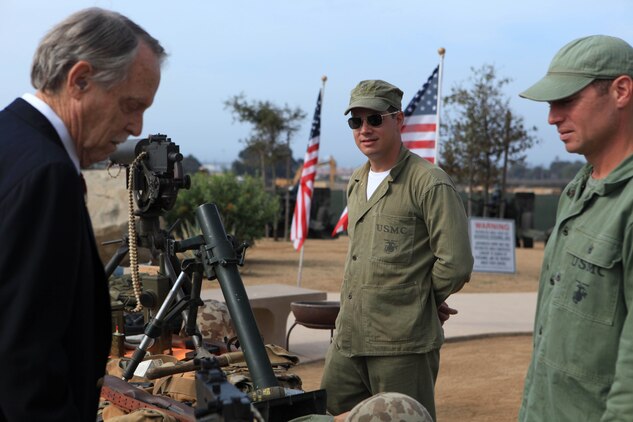 Volunteers from the United States Marine Corps Historical Company speak to an attendee during the 62nd Memorial Anniversary of the Korean War at Camp Pendleton?s Pacific Views Event Center, Sept. 22. The event was held to honor the veterans who fought during the Landing on Inchon, in the street of Seoul and in the northern mountains near the Chosen Reservoir.