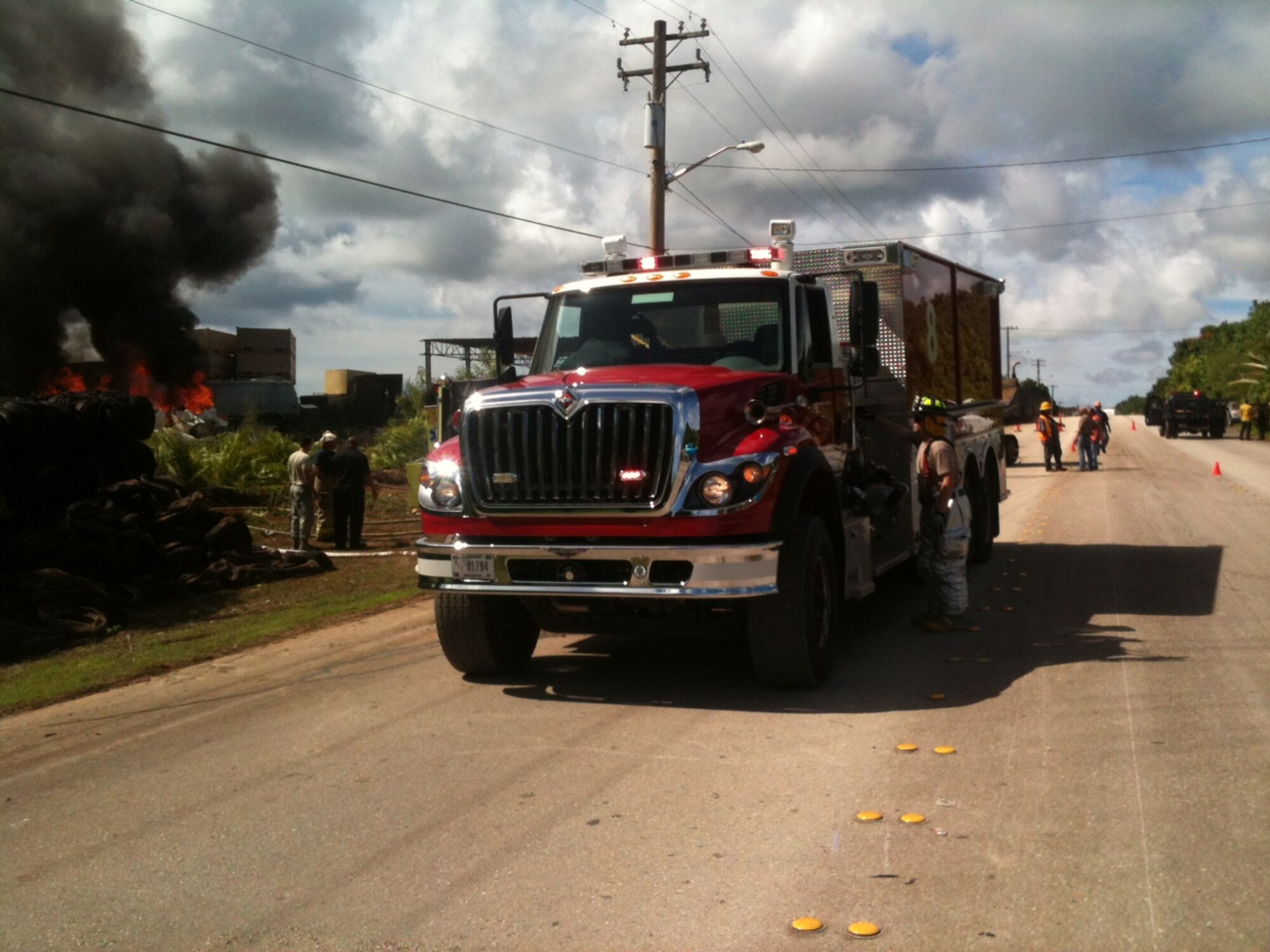 Dededo, Guam – The Andersen Fire Department assists the Guam Fire Department in fighting a fire located outside Andersen AFB  Sept. 17. The Andersen Fire Department assists and receives assistance from local first responders when the need arises. (U.S. Air Force courtesy photo/Released)