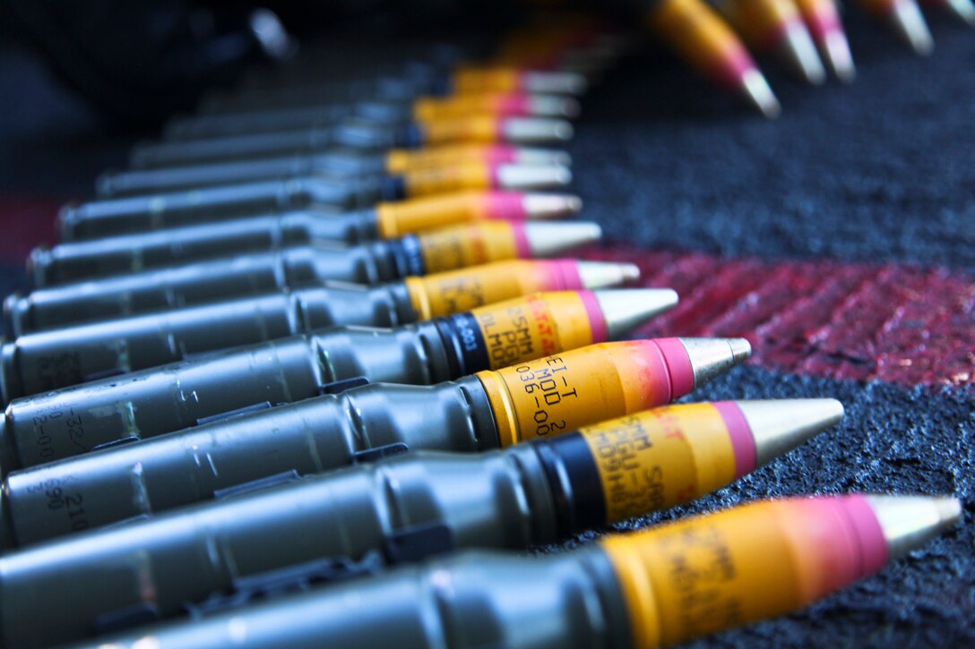 Mark 38 25mm Canon rounds lay on the deck aboard the USS Peleliu before being fired during a live-fire exercise, Sept. 22.