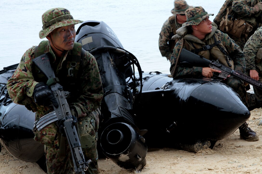 Marines and Sailors Battalion Landing Team 2nd Battalion, 1st Marine Regiment, 31st Marine Expeditionary Unit along with soldiers with 1st Company, 51st Infantry Regiment, 15th Brigade, Japanese Ground Self Defense Force dismount from combat rubber raiding craft during a boat raid here, September 22. The JGSDF are integrated into BLT 2/1 during the MEU’s Fall Patrol deployment, where they conduct bilateral exercises to help strengthen military ties between Japan and the US. The 31st MEU is the only continuously forward-deployed MEU and is the Marine Corps’ force in readiness in the Asia-Pacific region.