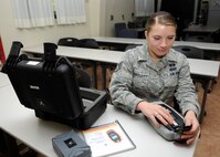 Staff Sgt. Ashley Bartlett, 8th Civil Engineer Squadron emergency management journeyman, demonstrates how to use a chemical identifier Sept. 24, 2012, at Kunsan Air Base, Republic of Korea. Emergency managers use many technical tools like this during both real-world and exercise scenarios. (U.S. Air Force photo/Senior Airman Brigitte N. Brantley)
