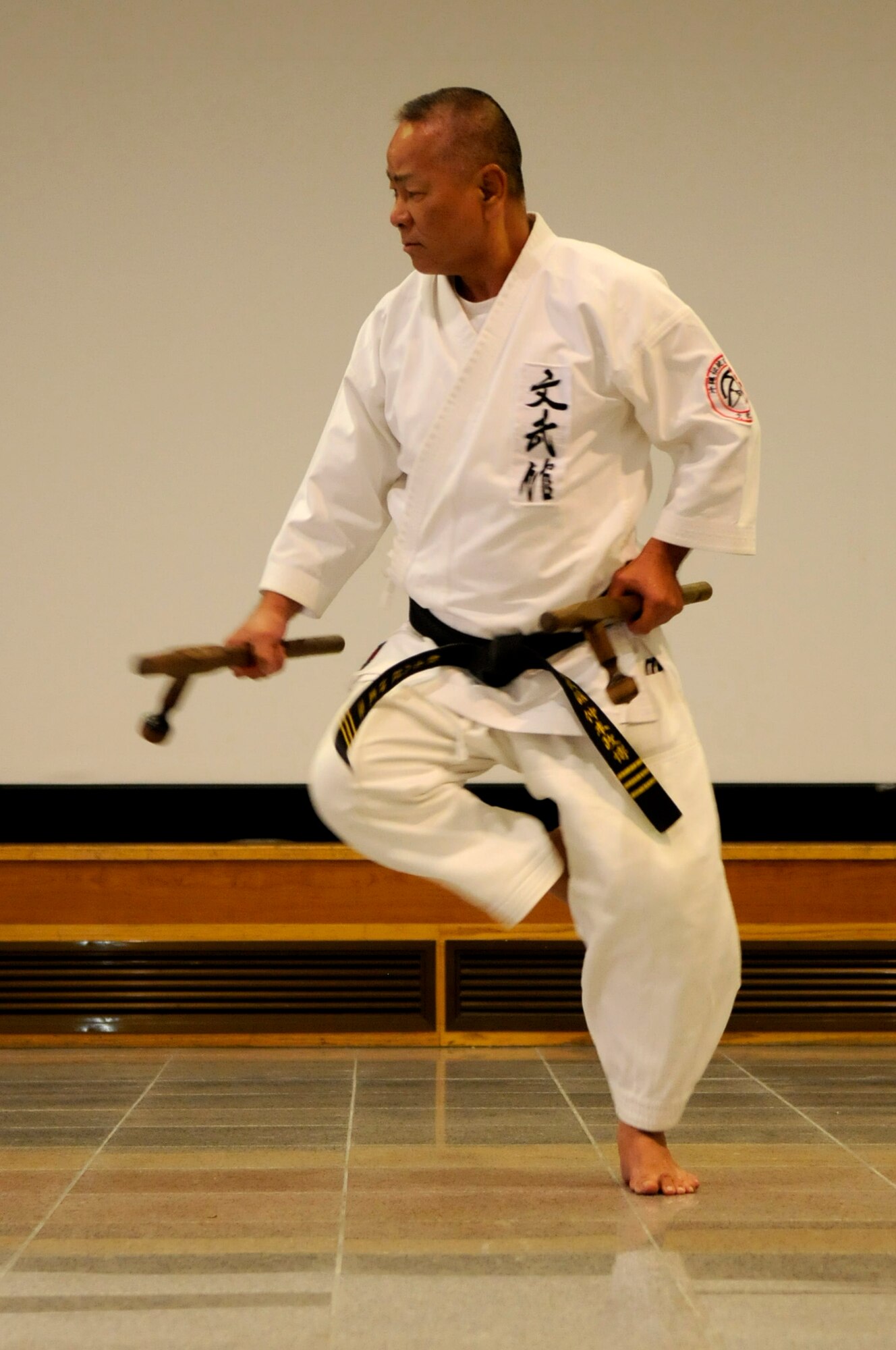Takashi Nakimori, a karate sensei for the Okinawa Traditional Kobudo Preservation Society, demonstrates traditional Okinawan karate techniques during a cultural seminar at the Schilling Community Center on Kadena Air Base, Japan, Sept. 21. This was the fourth year Nakimori and his team taught karate to U.S. service members on Kadena. (U.S. Air Force photo/Airman Tara A. Williamson)