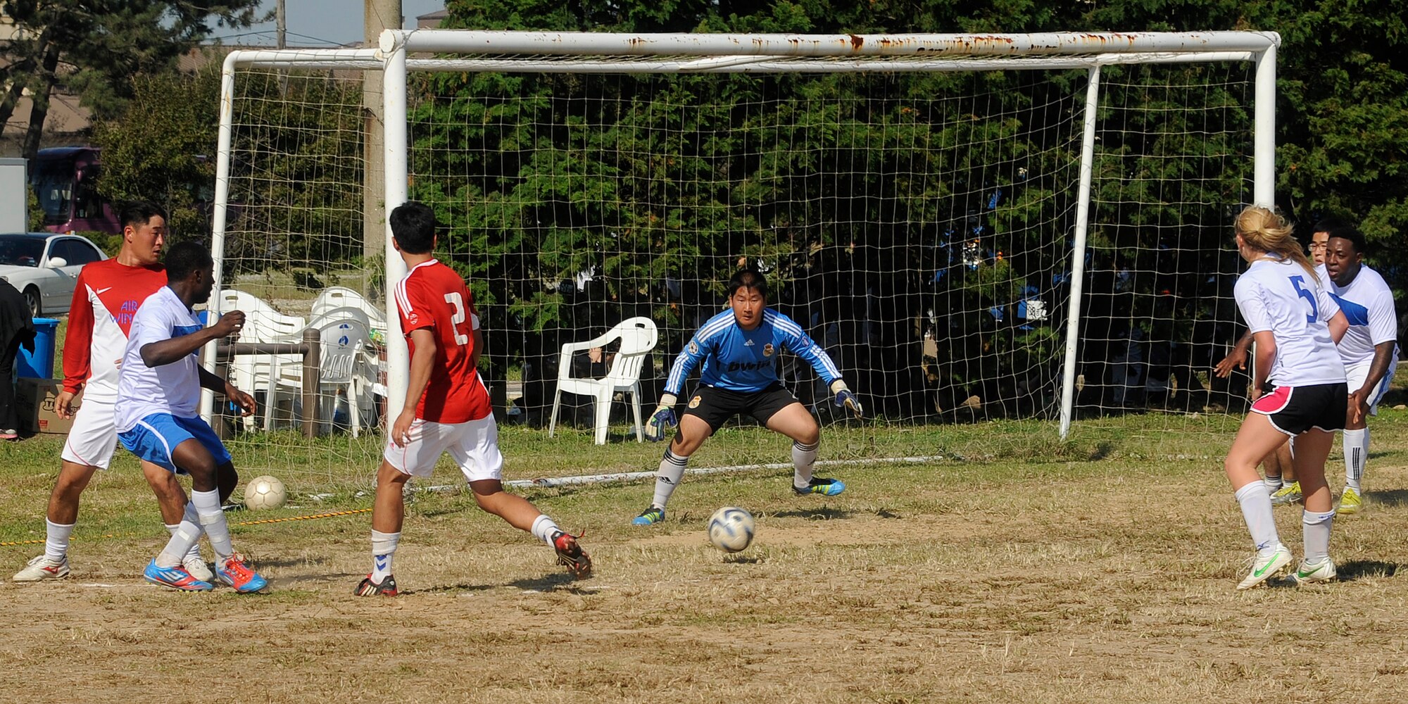 Members of the United States Air Force 8th Fighter Wing shoot against the Republic of Korea 38th Fighter Group goalie during a soccer match at Kunsan Air Base Republic of Korea, Sept. 20, 2012. Both teams pushed the other to work hard during the 40 minute game. (U.S. Air Force photo/ Senior Airman Marcus Morris)