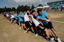 Members of the Republic of Korea Air Force 38th Fighter Group compete in tug of war against 8th Maintenance Squadron at Kunsan Air Base, Republic of Korea, Sept. 20, 2012. Although the 38th FG beat the 8th Mission Support Group, they were unable to beat the 8th MXS who took first place. (U.S. Air Force photo/ Senior Airman Marcus Morris)