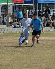 A member  of the United States Air Force commanders team tries to kick a soccer ball past a Republic of Korea Air Force commanders team defender during 2012 Kunsan Olympics USAF commanders versus RoKAF commanders soccer match on Kunsan Air Base, Republic of Korea, Sept. 20, 2012. The match featured teams made up of primarily wing, group and squadron level commanders and was a friendly competition between the two Air Forces. The RoKAF won the 20 minute match two to one. (U.S. Air Force photo/Staff Sgt. Jonathan Fowler)