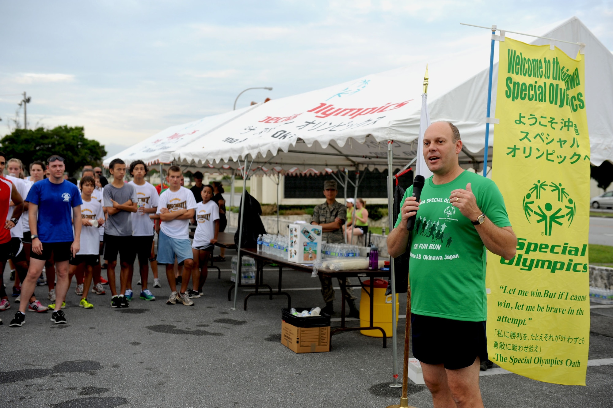 U.S. Air Force Col. Jeffrey Ullmann, 18th Mission Support Group commander, thanks a group of participants for their contribution to the Kadena Special Olympic Shades of Green 5k on Kadena Air Base, Japan, Sept. 22, 2012. The KSO is an annual event held on base, supporting more than 5,000 special-needs athletes, artists, volunteers and supporters. (U.S. Air Force photo/ Airman 1st Class Brooke P. Beers)