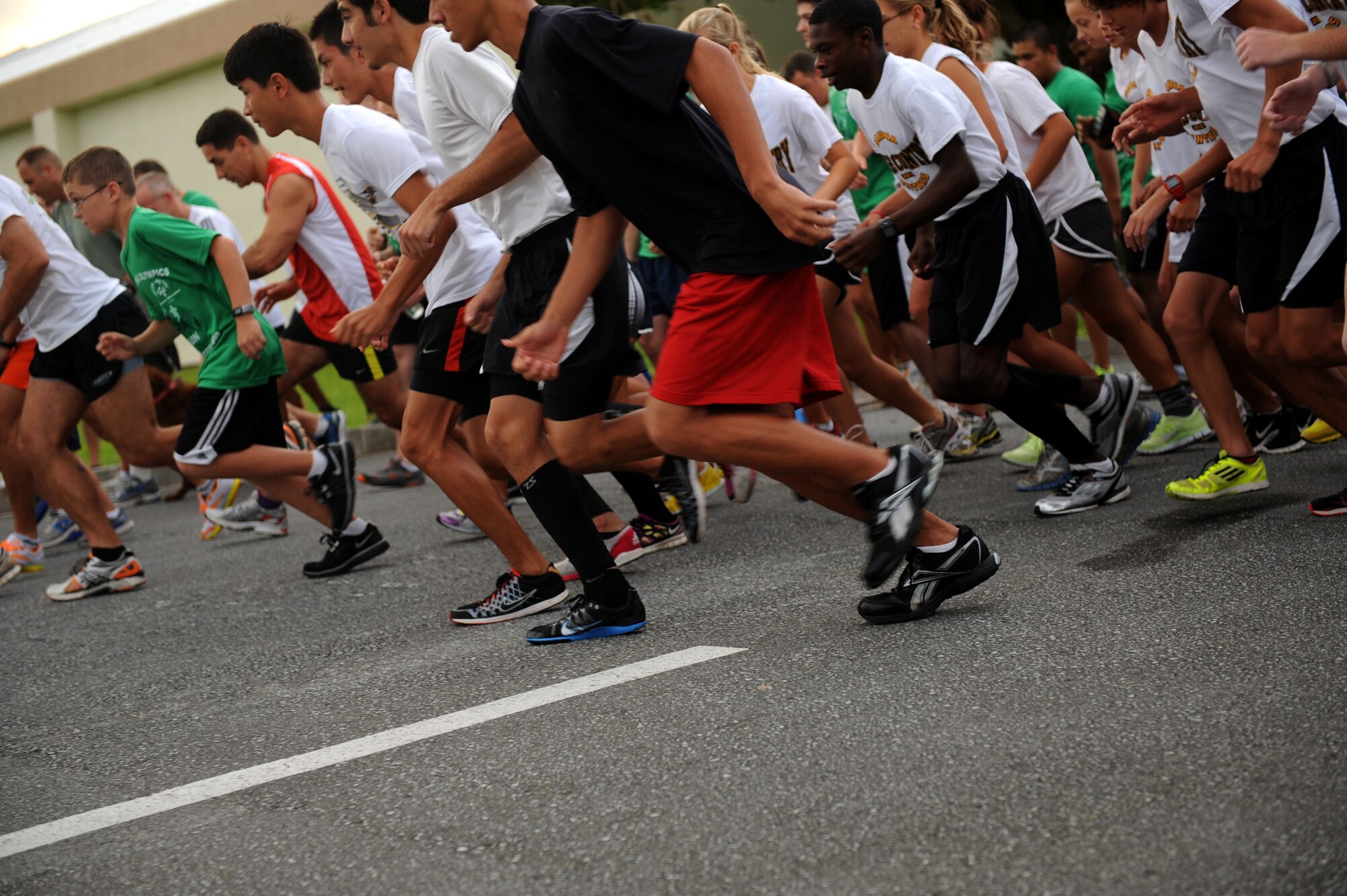 Participants begin running a 5k in support of the Kadena Special Olympics Shades on Kadena Air Base, Japan, Sept. 22, 2012. The KSO is an annual event held on base, supporting more than 5,000 special-needs athletes, artists, volunteers and supporters. (U.S. Air Force photo/ Airman 1st Class Brooke P. Beers)