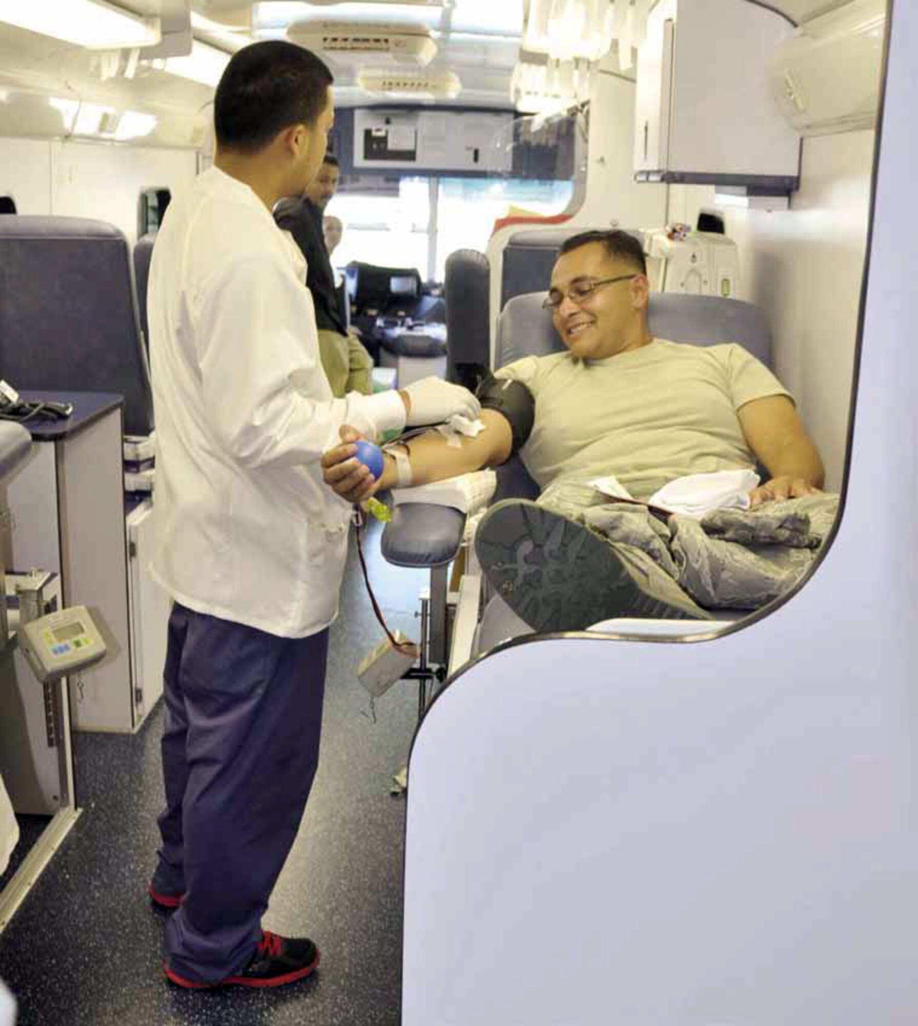 Senior Airman Jacob Fejeran, 452nd Aerospace Medicine Squadron, donates blood Sept. 9. The 452 AMDS, partnered with the American Red Cross, Pomona, Calif. division, to sponsor the blood drive at March Air Reserve Base. Team March members donated a total of 50 units, totaling 23,500 milliliters, of blood during the drive. According to its website, the ARC is the largest single supplier of blood and blood products in the United States, collecting and processing more than 40 percent of the blood supply and distributing it to some 3,000 hospitals and transfusion centers nationwide. (U.S. Air Force photo by Senior Amn. Isis Ponce)