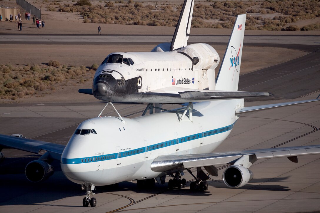 Space Shuttle Endeavour being ferried by a modified 747 aircraft, leaving Edwards AFB, CA. on September 21, 2012.  US Air Force Photo by Christian Turner.