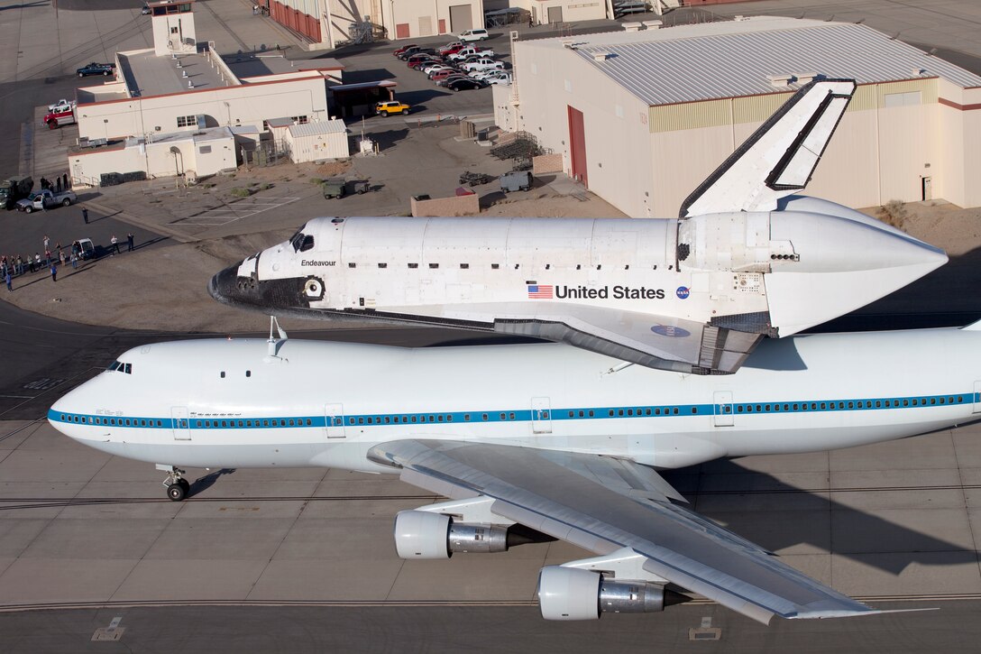 Space Shuttle Endeavour being ferried by a modified 747 aircraft, leaving Edwards AFB, CA. on September 21, 2012.  US Air Force Photo by Christian Turner.