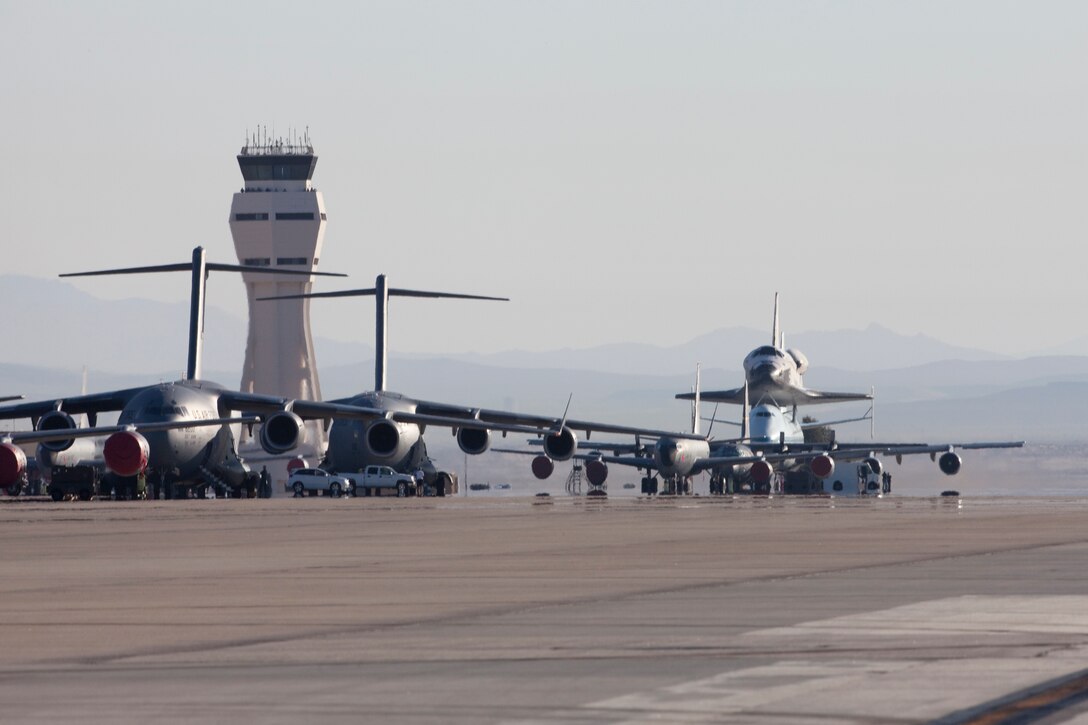 "One of these things is not like the other."
Space Shuttle Endeavor departs Edwards AFB for thefinal time before being flown to it's final destination in a Southern California museum.