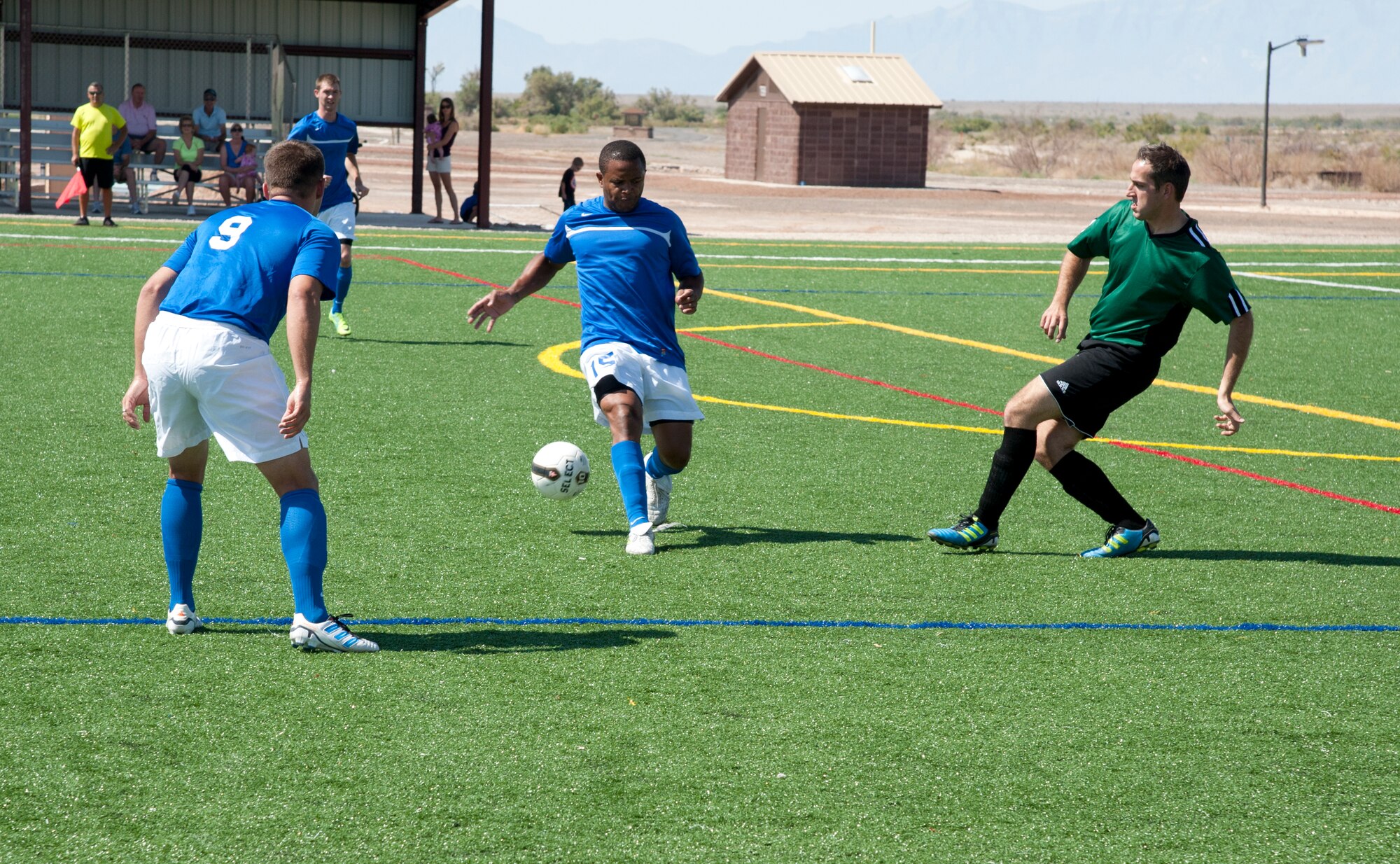 Members from the U.S. Holloman AFB soccer team and German Air Force soccer team compete against one another during the 3rd annual Oktobercup Sept. 22, at the Holloman AFB soccer complex. Col. Andrew Croft, 49th Wing commander and Col. Armin Havenith, German Air Force Flying Training Center Commander agreed to a challenge to play an international soccer match between the U.S. Air Force Holloman AFB team and German Air Force Flying Training Center soccer team. The GAF won the game 4 to 0. (U.S. Air Force photo by Airman 1st Class Colin Cates/Released)