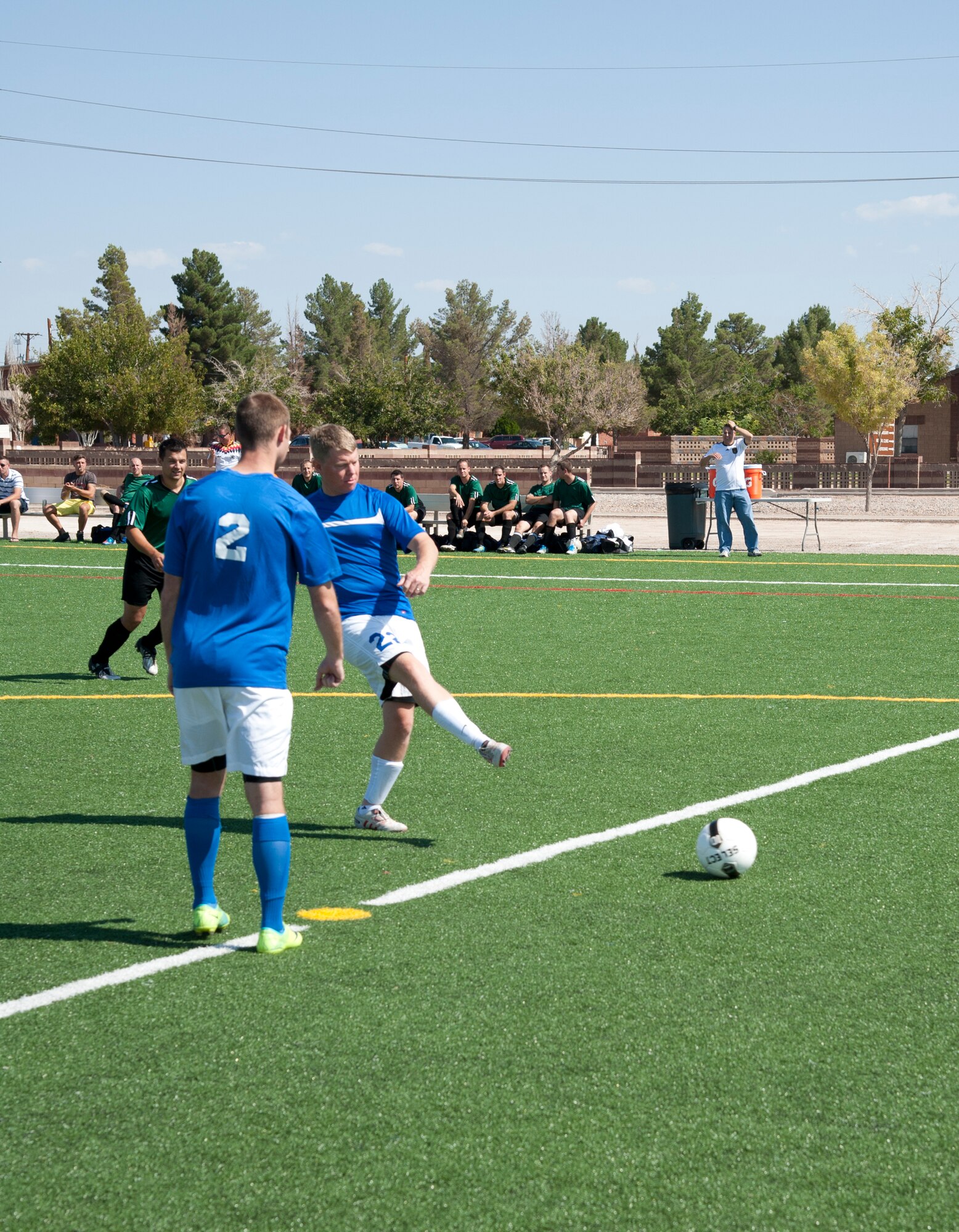 Colonel Andrew Croft, 49th Wing commander, kicks the traditional first kick to start the 3rd annual Oktobercup Sept. 22, at the Holloman Air Force Base, N.M., soccer complex. Croft and Col. Armin Havenith, German Air Force Flying Training Center commander agreed to a challenge to play an international soccer match between the U.S. Air Force Holloman AFB team and German Air Force Flying Training Center soccer team.  The GAF won the game 4 to 0. (U.S. Air Force photo by Airman 1st Class Colin Cates/Released) 