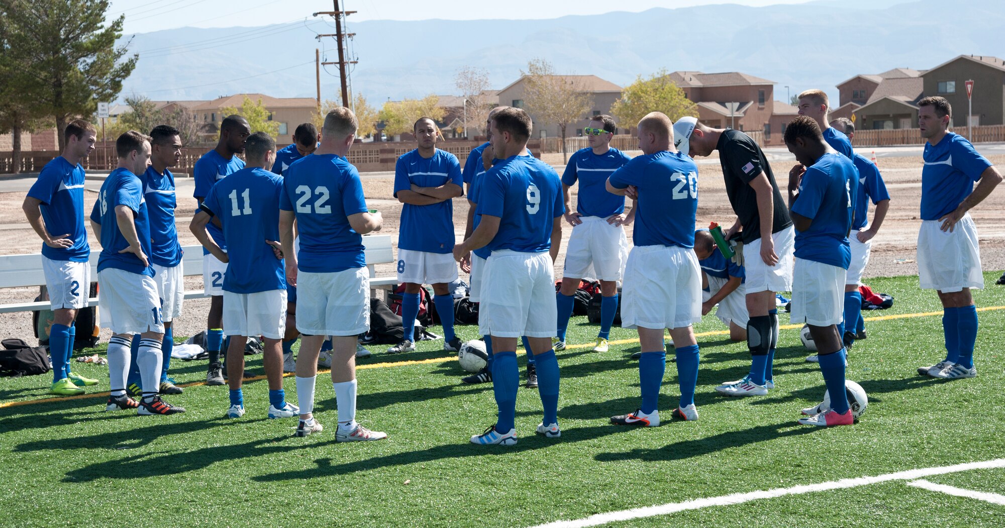 Members from the U.S. Air Force Holloman AFB soccer team gather to talk strategy during the 3rd annual Oktobercup Sept. 22 at the Holloman Air Force Base, N.M., soccer complex. The international soccer game between the U.S. Air Force Holloman AFB team and German Air Force Flying Training Center team was an opening event to the Oktoberfest activities which ensued later that evening. (U.S. Air Force photo by Airman 1st Class Colin Cates/Released)