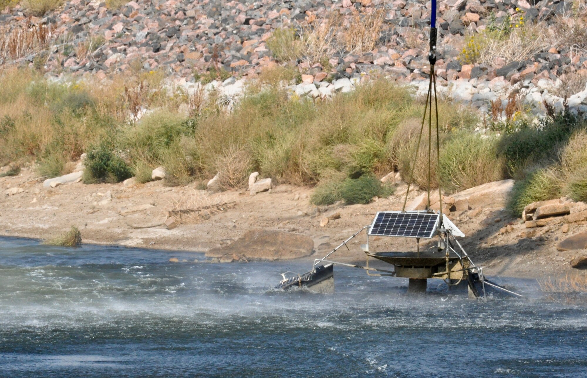 BUCKLEY AIR FORCE BASE, Colo. – A non-functioning aerator was lifted from the shallow waters of Lake Williams Sept. 20, 2012.  The Colorado Army National Guard teamed up with the 460th Civil Engineer Squadron to remove the device from the lake. (U.S. Air Force photo by Staff Sgt. Nicholas Rau)