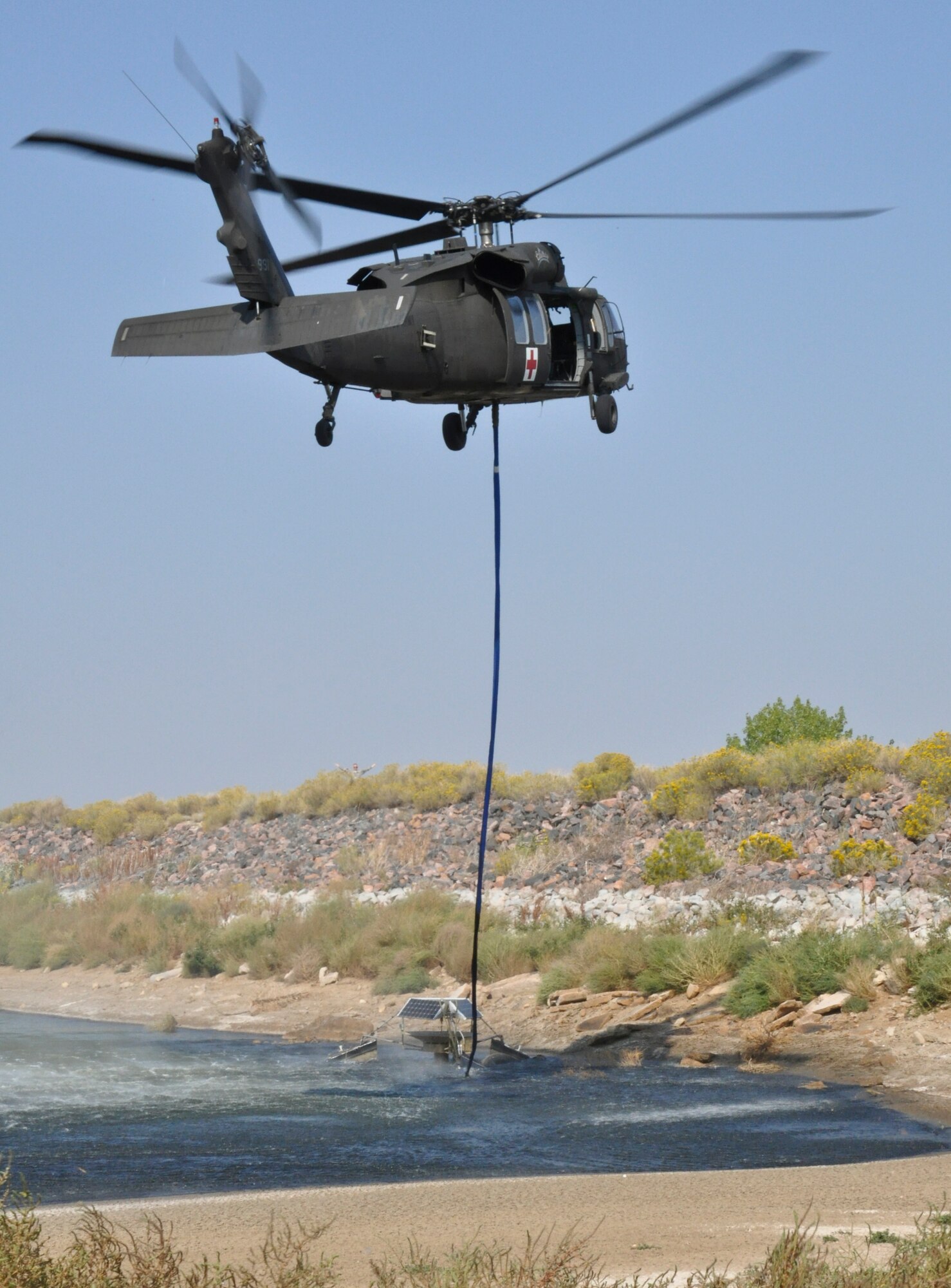 BUCKLEY AIR FORCE BASE, Colo. – A Colorado Army National Guard UH-60 Black Hawk helicopter lifts a non-functioning aerator from Lake Williams Sept. 20, 2012. “The removal of the aerator has the potential to save lives by aiding flight safety in the reduction of birds perching on the open water of Lake Williams,” explained Krystal Phillips, 460th Civil Engineer Squadron fish and wildlife biologist.  “This is a critical component of the Air Force and Buckley Air Force Base Bird Air Strike Hazard program.” (U.S. Air Force photo by Staff Sgt. Nicholas Rau)  