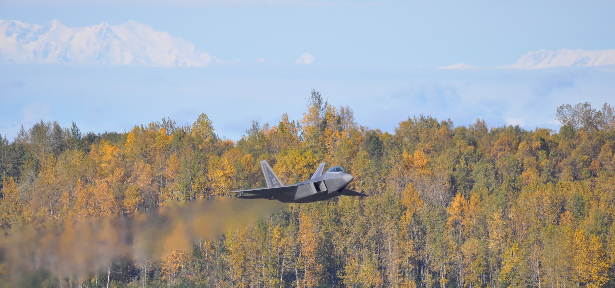 An F-22 flies over JBER prior to landing during the 525 Fighter Squadron Blue Carpet day. The spouses of active duty and Reserve F-22 pilots from the 525th and 302nd Fighter Squadrons received an up close look at the F-22 mission during the Spouses Blue Carpet day here Sept. 21. The tour consisted of a commanders briefing, and tours of the Air Traffic Control Tower, Egress Trainer and Hush House. (U.S. Air Force Reserve/Tech. Sgt. Dana Rosso) 