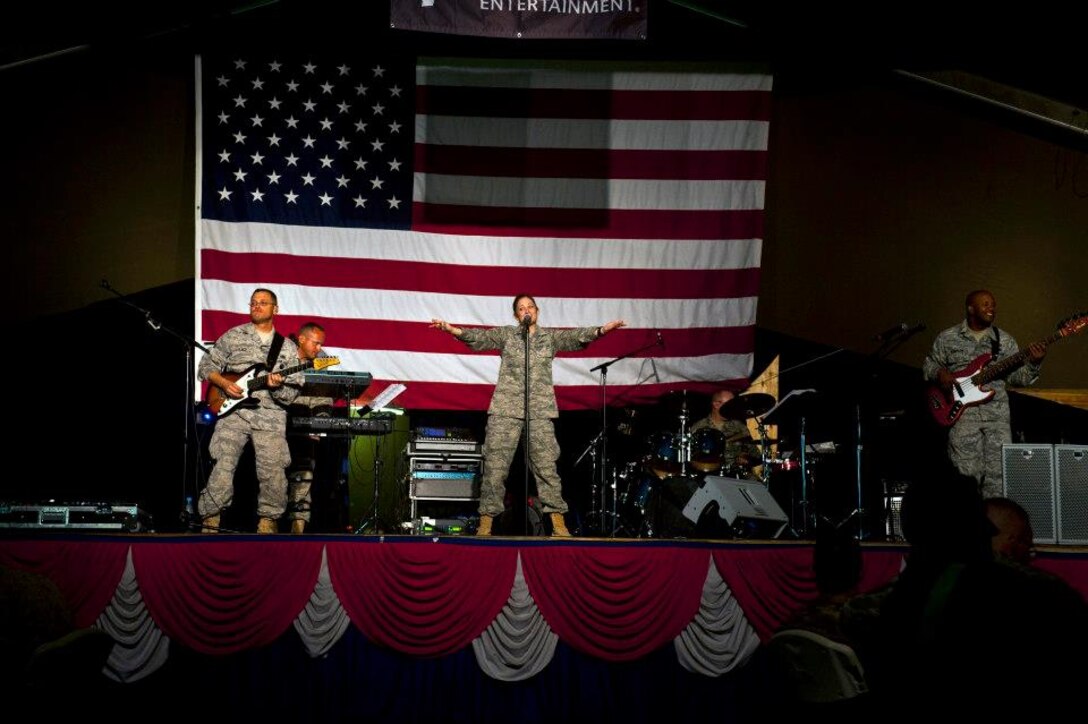 The U.S. Air Forces Central Band "Top Flight" performs inside Pete's Place at the Transit Center at Manas, Kyrgyzstan, Sept. 21, 2012. Top Flight plays different varieties of classic rock. The six-member band is deployed from Joint Base San Antonio, Texas. (U.S. Air Force photo/Senior Airman Brett Clashman)