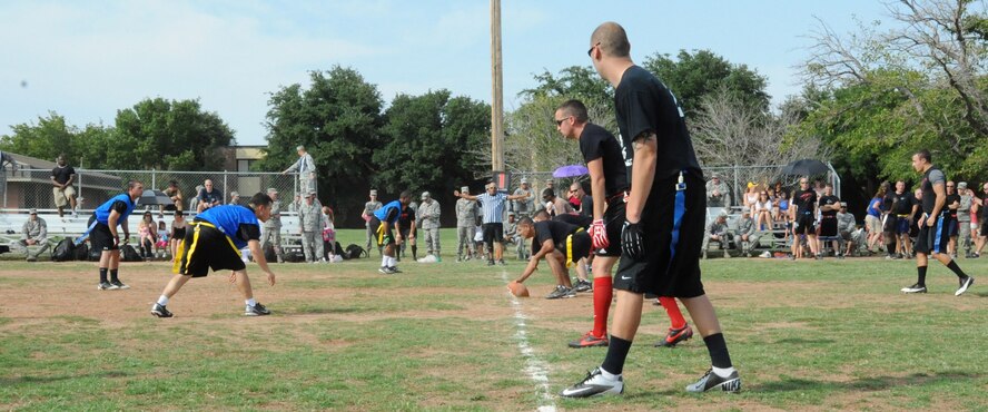 Airmen-in-Training from the 366th Training Squadron square off against their Instructors in the third annual Combined Federal Campaign flag football game on Sept. 21. Over $2,600 in donations were raised and donated to the foundation "Autism Speaks." (U.S. Air Force Photo/Kimberly Dagdag)