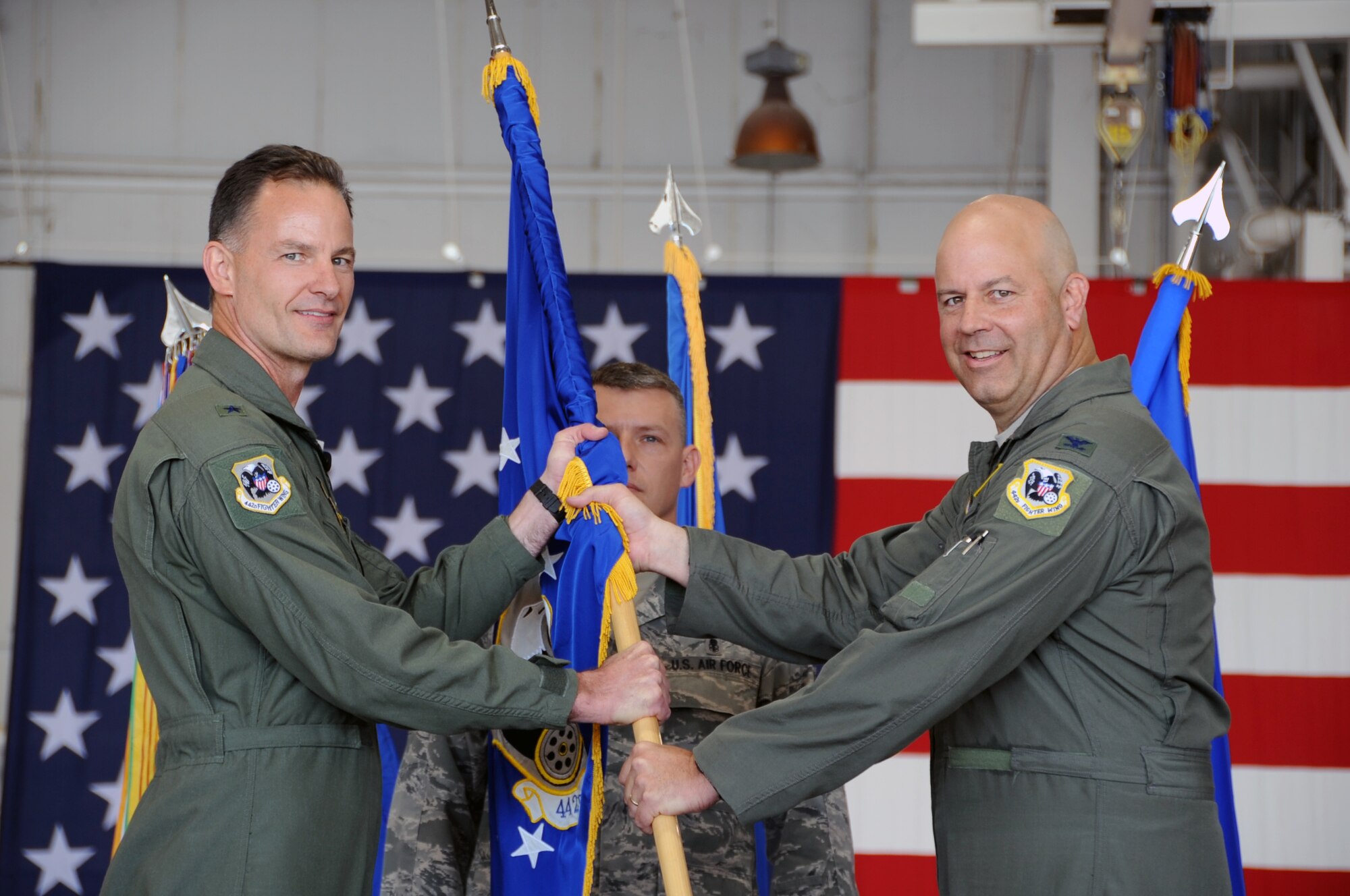 Col. Brian Borgen accepts the guidon from Brig. Gen. Eric Overturf during a change of command ceremony, Sept. 9, 2012. Borgen, who took command of the group from lt. Col. Stephen Chappel, is the former commander of the 303rd Fighter Squadron. The 442nd Operations Group is part of the 442nd Fighter Wing, an A-10 Thunderbolt II Air Force Reserve unit at Whiteman Air Force Base, Mo. (U.S. Air Force photo by Staff Sgt. Lauren Padden/Released)
