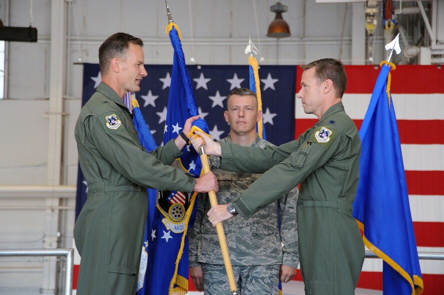 Brig. Gen. Eric Overturf, 442nd Fighter Wing commander, takes the guidon from Lt. Col. Stephen Chappel during a change-of-command ceremony for the 442nd Operations Group, Sept. 9, 2012. During the ceremony, Col. Brian Borgen took command of the group. The 442nd Operations Group is part of the 442nd Fighter Wing, an A-10 Thunderbolt II Air Force Reserve unit at Whiteman Air Force Base, Mo. (U.S. Air Force photo by Staff Sgt. Lauren Padden/Released)
