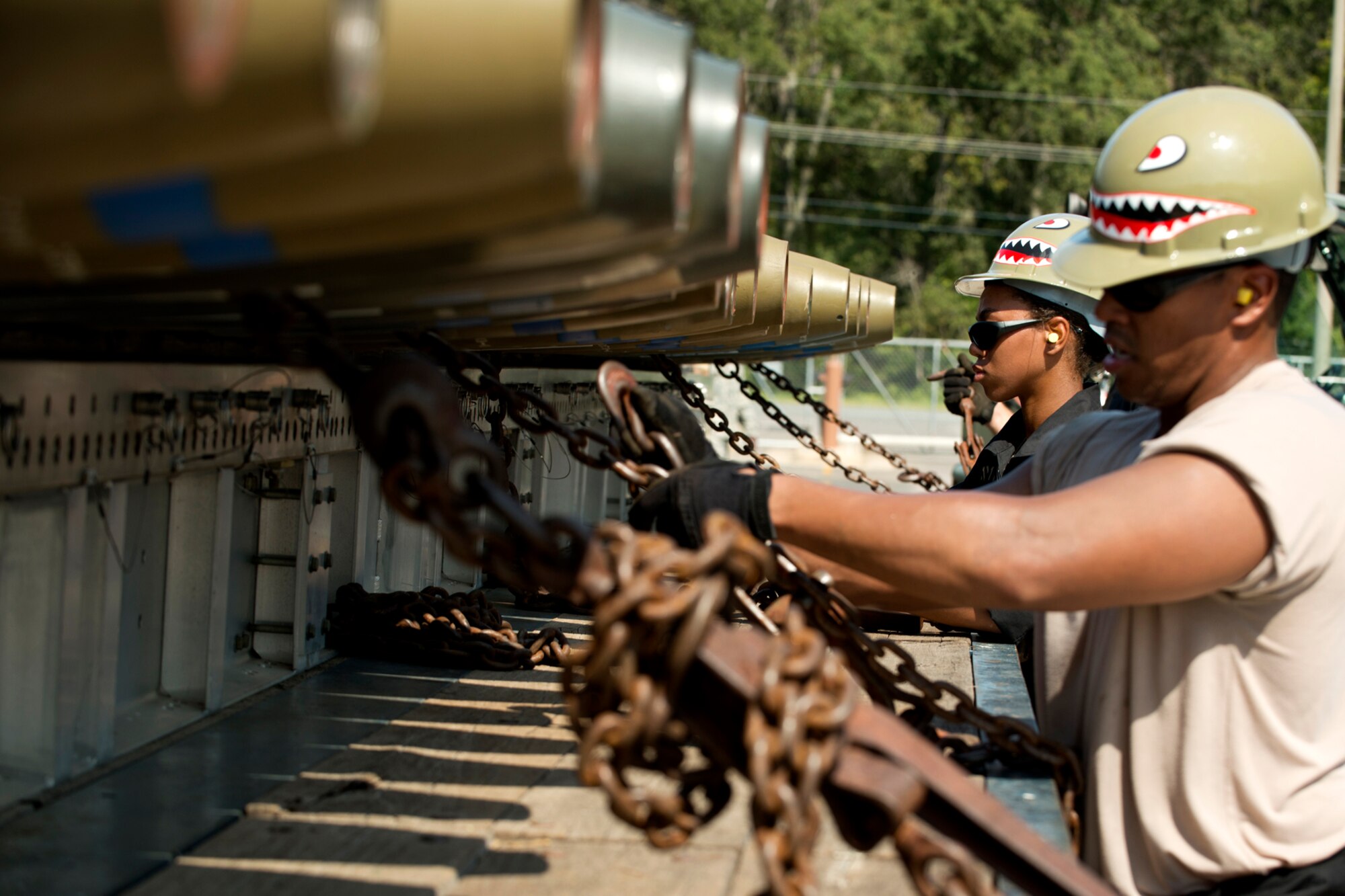 Munitions technicians assigned to the 307th Maintenance Squadron secure a trailer load of 500 pound general purpose bombs during a competition event for the Global Strike Challenge, Sept. 13, 2012, Barksdale Air Force Base, La. The timed event consisted of the team loading and securing 126 bombs on three trailers. (U.S. Air Force photo by Master Sgt. Greg Steele/Released)