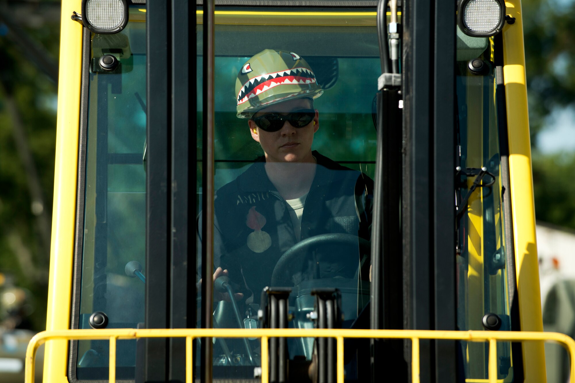 U.S. Air Force Senior Airman Laura McMillen, 307th Maintenance Squadron munitions technician, operates a forklift during the bomb build competition for the Global Strike Challenge, Sept. 13, 2012, Barksdale Air Force Base, La. The bomb build is a timed event and the munitions team was evaluated on proper safety and technical procedures. (U.S. Air Force photo by Master Sgt. Greg Steele/Released)