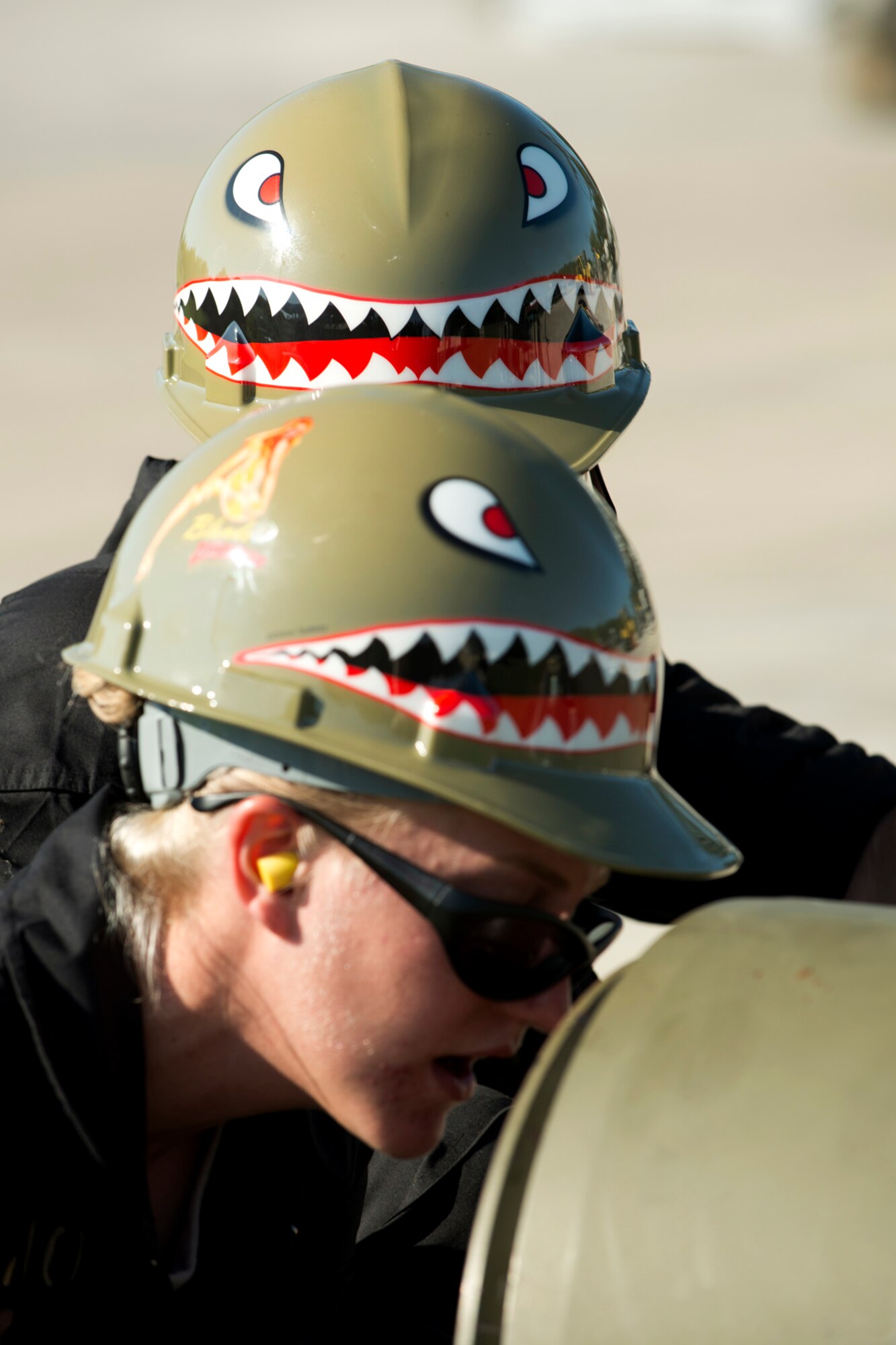 Wearing specially designed hard hats for the event, a team of 307th Maintenance Squadron munitions technicians race to assemble 16 2000 pound Joint Direct Attack Munitions during the Global Strike Challenge (GSC), Sept. 13, 2012, Barksdale Air Force Base, La. The GSC is the world's premier bomber, intercontinental ballistic missile and security forces competition with units participating from Air Force Global Strike Command, Air Combat Command, Air Force Material Command, Air Force Reserve Command and the Air National Guard. (U.S. Air Force photo by Master Sgt. Greg Steele/Released)