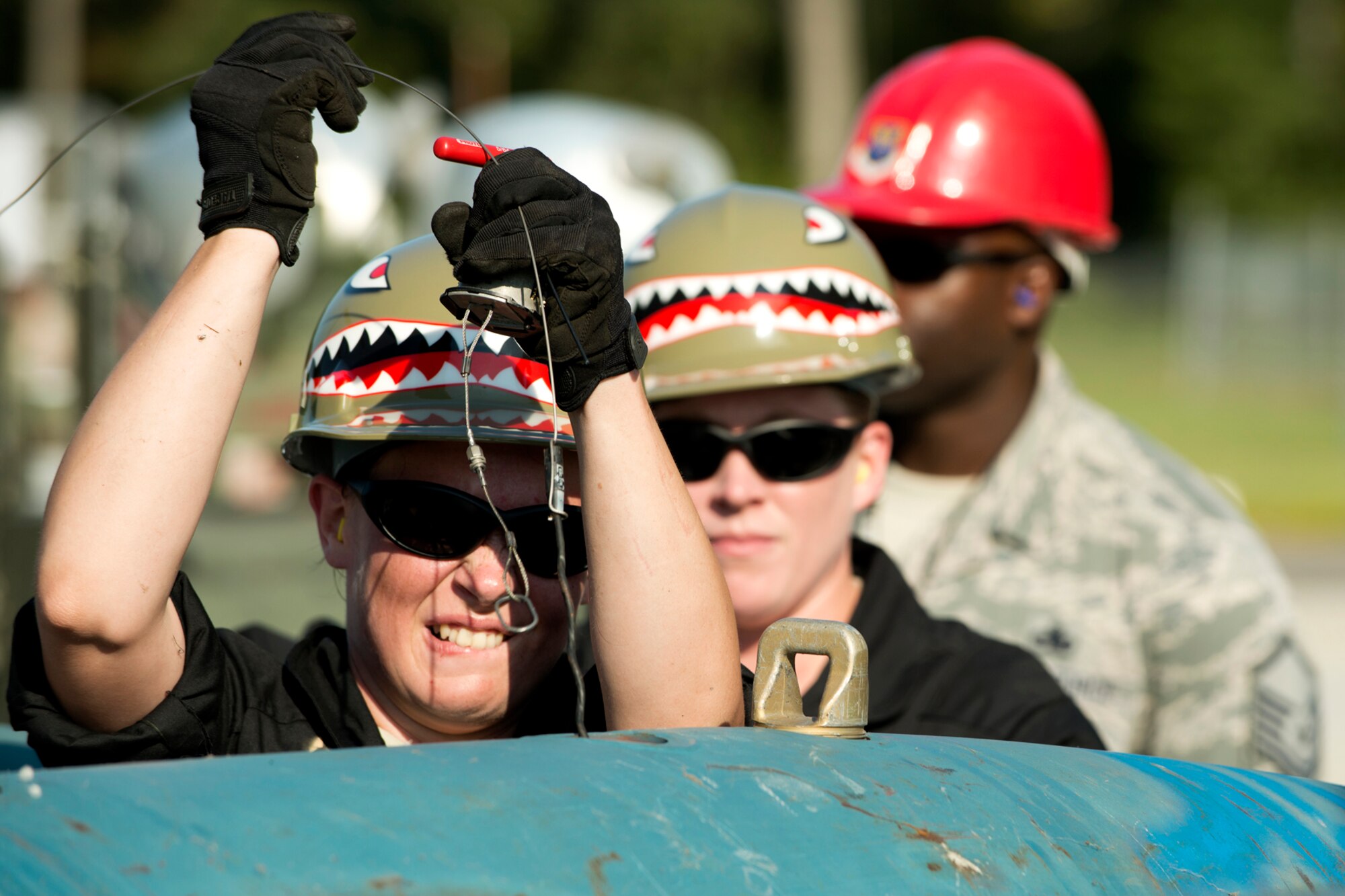 U.S. Air Force Senior Airman Teresa Procell, 307th Maintenance Squadron munitions technician, installed arming wire in a 2000 pound Joint Direct Attack Munition (JDAM) during a bomb build competition for the Global Strike Challenge, Sept. 13, 2012, Barksdale Air Force Base, La. The munitions team was tasked with building 16 JDAMs during the timed event. (U.S. Air Force photo by Master Sgt. Greg Steele/Released)