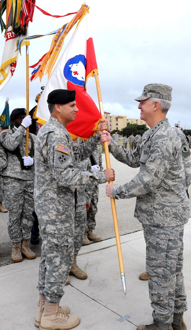 Air Force Gen. Douglas Fraser (left), commander of U.S. Southern Command, speaks to attendees of the U.S. Army South change of command ceremony between Maj. Gen. Frederick S. Rudesheim (center), the incoming commanding general of U.S. Army South, and Maj. Gen. Simeon G. Trombitas (right), the outgoing Army South commanding general, during their change of command ceremony at Joint Base San Antonio-Fort Sam Houston Sept. 14. (Photo by Eric R. Lucero, U.S. Army South Public Affairs)