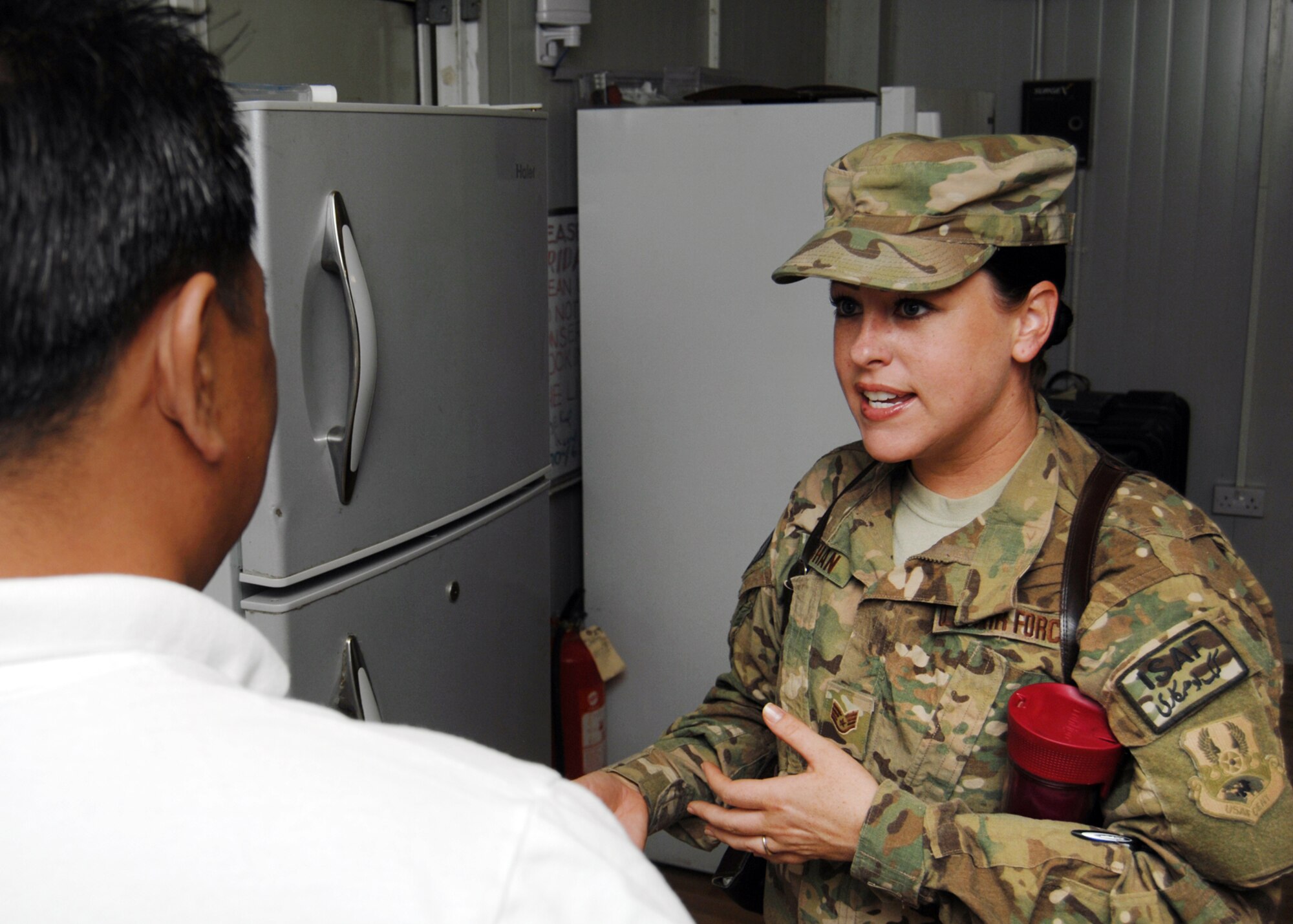 Staff Sgt. Jennifer Vaughan speaks with the manager of a camp that was inspected recently at Kandahar Airfield, Afghanistan, Sept. 13, 2012. Vaughan is a 451st Air Expeditionary Wing public health technician and offers directions and advice to the managers to bring their kitchen and dining facilities up to standards. (U.S. Air Force photo/Master Sgt. Russell Martin)
