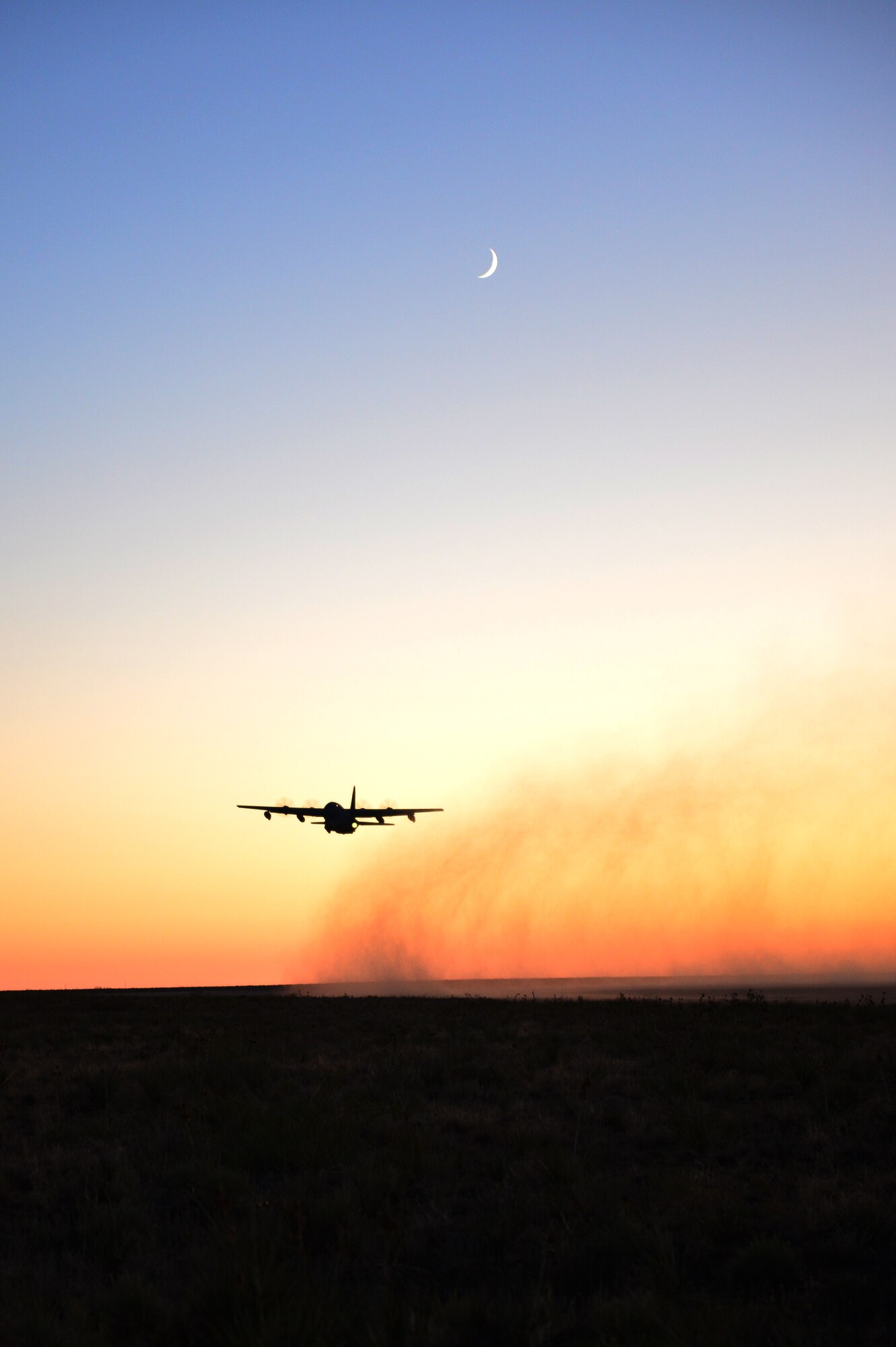 A C-130 takes off into the sunset at Melrose Air Force Range, N.M., Sept 19, 2012. Melrose has been an integral part of Cannon Air Force Base, N.M., since the early 1950s. (U.S. Air Force photo/Airman 1st Class Eboni Reece)