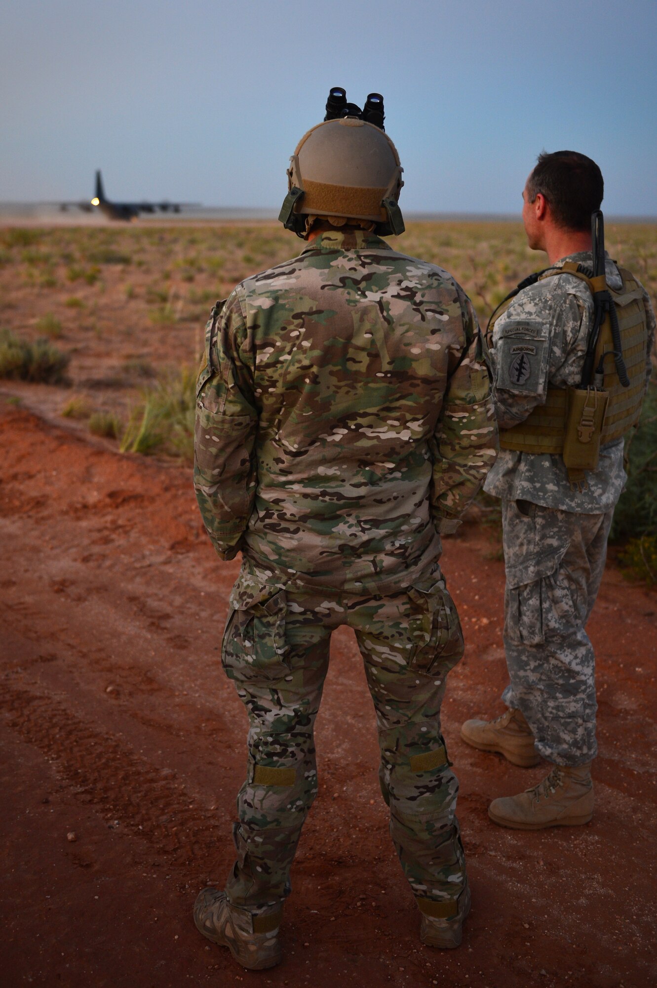 Soldiers with the 19th Special Forces Group watch as a C-130 prepares to take off at Melrose Air Force Range, N.M., Sept. 19, 2012. Melrose has been an integral part of Cannon Air Force Base, N.M., since the early 1950s. (U.S. Air Force photo/Airman 1st Class Eboni Reece)