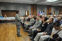 Col. Christine Erlewine, 902nd Mission Support Group commander, makes opening remarks during the retiree appreciation event held at Joint Base San Antonio-Randolph, Texas, Sept. 22. The event is held annually at the Kendrick Club to educate the local retiree community on services available to them. (U.S. Air Force photo by Rich McFadden) 