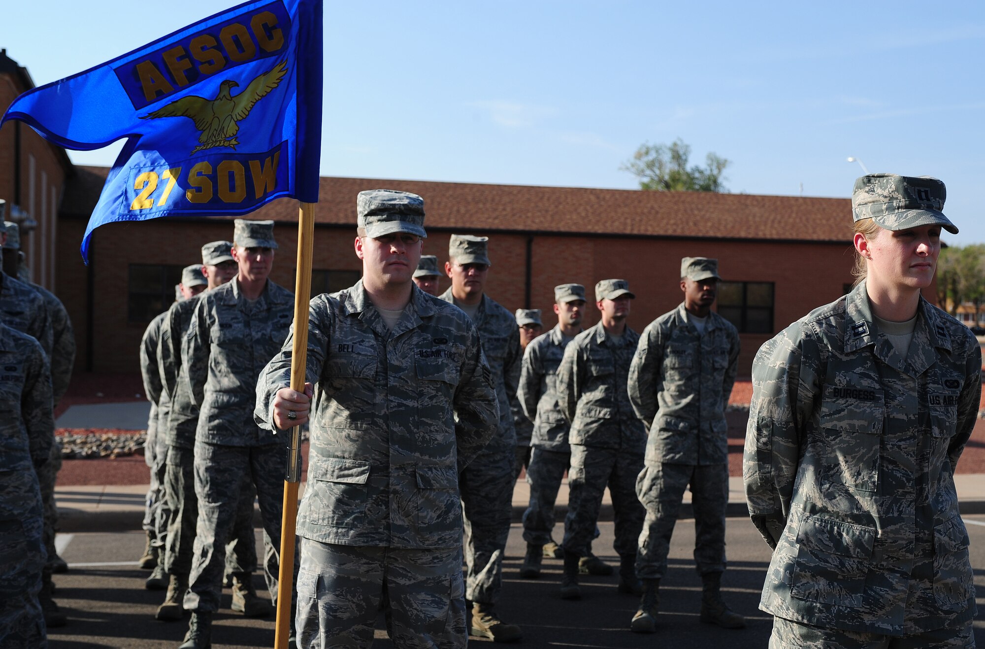 The 27th Special Operations Wing Staff Agency lead by Capt. Anastasia Burgess, 27 SOW Public Affairs deputy chief, stands at parade rest during the Prisoner of War/Missing in Action Ceremony at Cannon Air Force Base, N.M., Sept. 21, 2012. The ceremony was held in honor of those service members who have fallen into enemy hands or have never been recovered. (U.S. Air Force photo by Airman 1st Class Ericka Engblom)