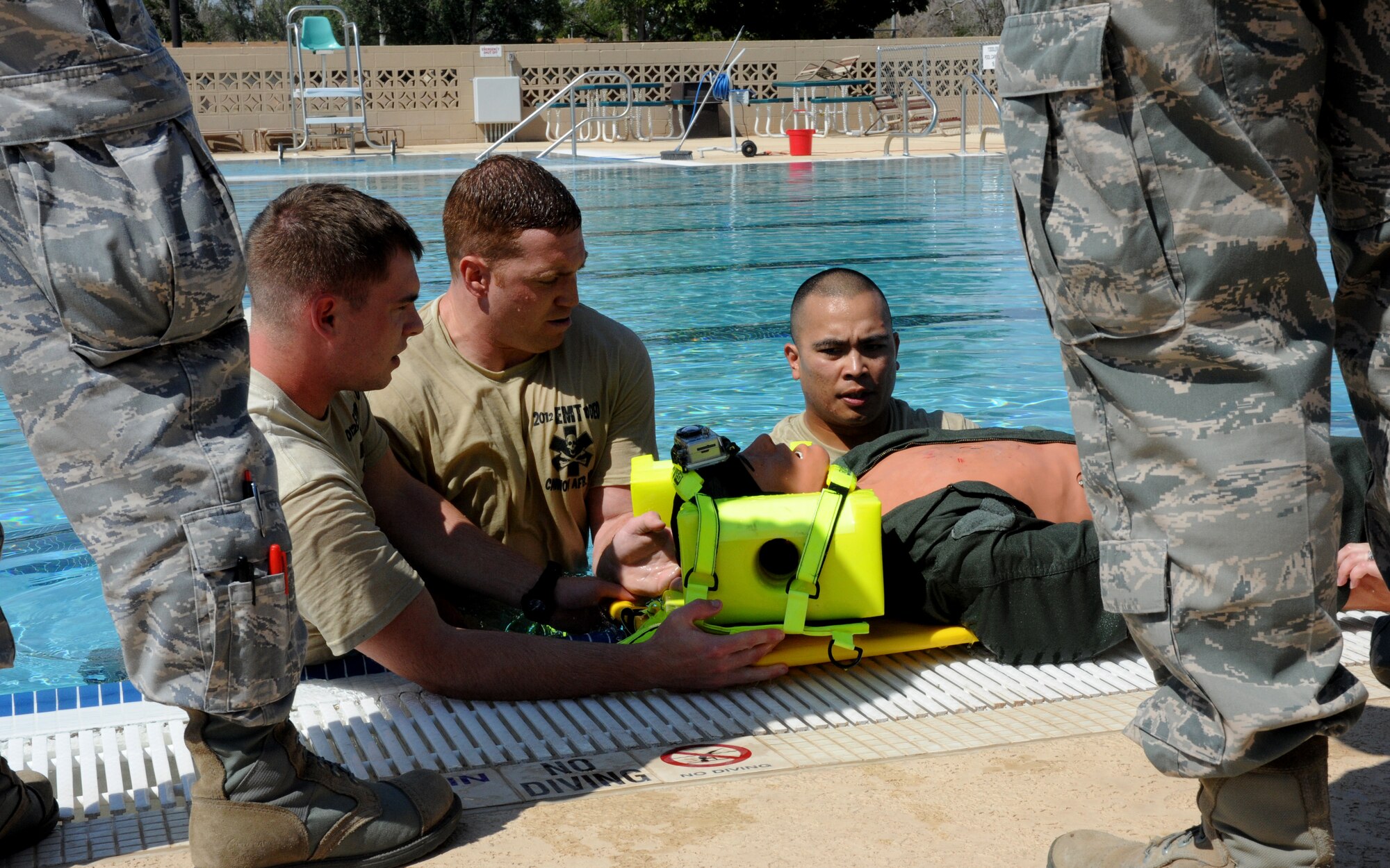 The emergency medical team from Fairchild Air Force Base, Wash., rescues a dummy as part of the water extraction challenge during the Emergency Medical Technician Rodeo at Cannon Air Force Base, N.M., Sept. 21, 2012. The EMT Rodeo is a competition in which EMT teams from across the United States and Germany test their skills in various events that simulate real life scenarios. (U.S. Air Force photo/Airman 1st Class Xavier Lockley)