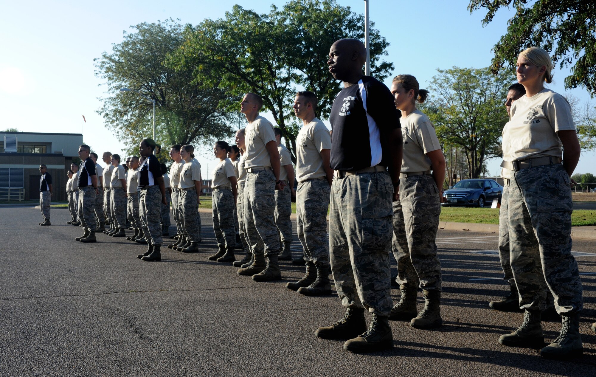 Participants of the Emergency Medical Technician Rodeo stand in formation before the start of events at Cannon Air Force Base, N.M., Sept. 21, 2012. The EMT Rodeo is a competition in which EMT teams from across the United States and Germany test their skills in various events that simulate real life scenarios. (U.S. Air Force photo/Airman 1st Class Xavier Lockley)